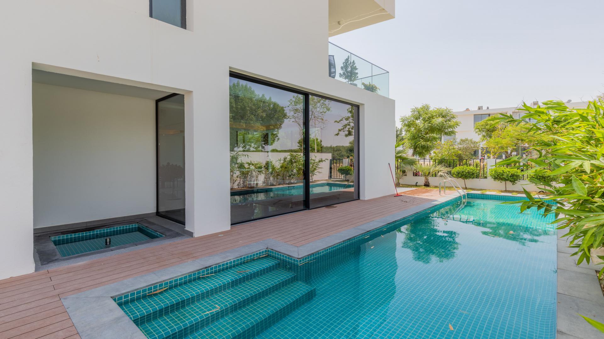 Interior hallway of luxury villa in Al Barari's Chorisia 1, featuring modern design elements