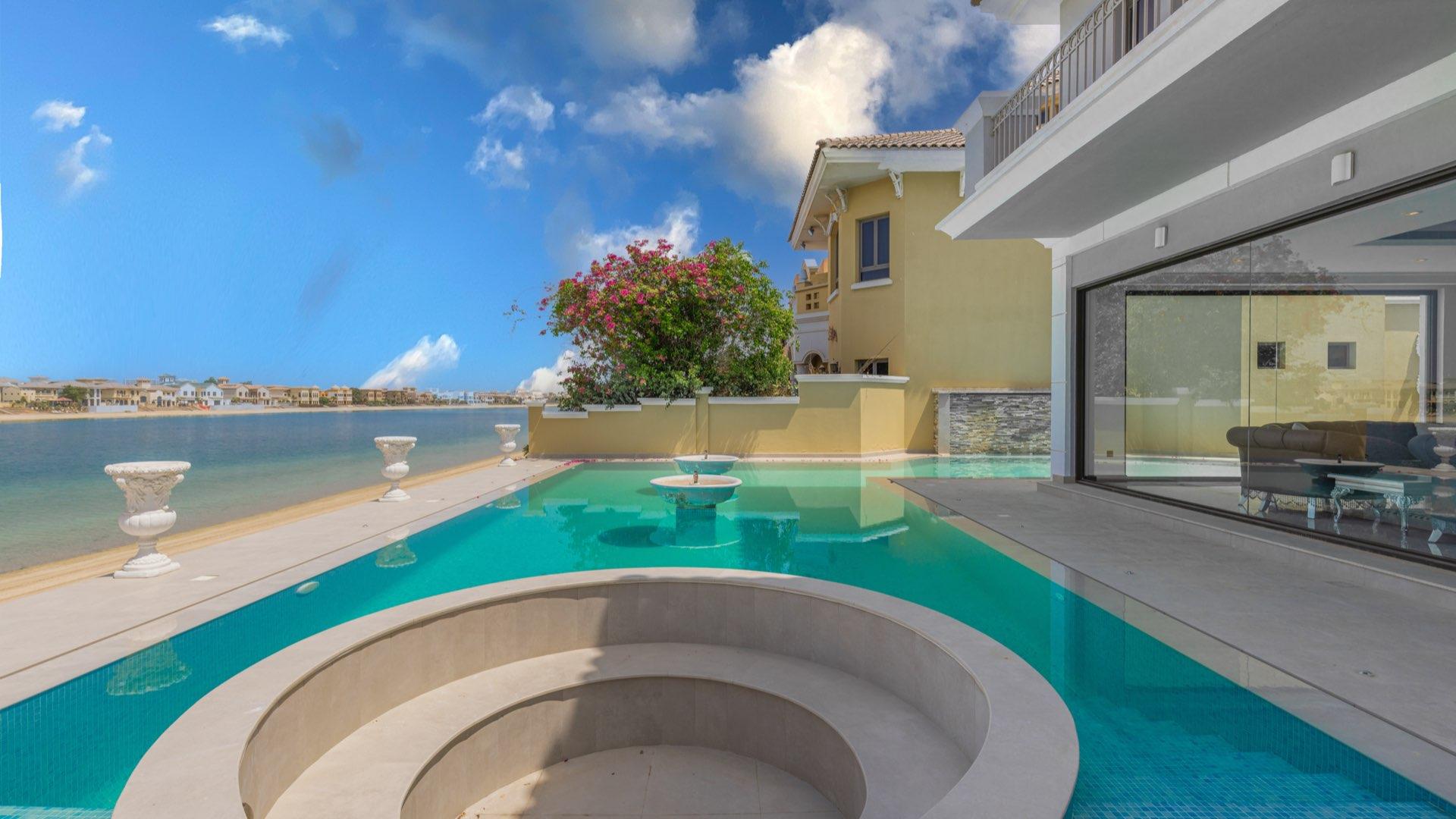 Upgraded Palm Jumeirah villa with pool, showcasing luxury architecture and outdoor living space