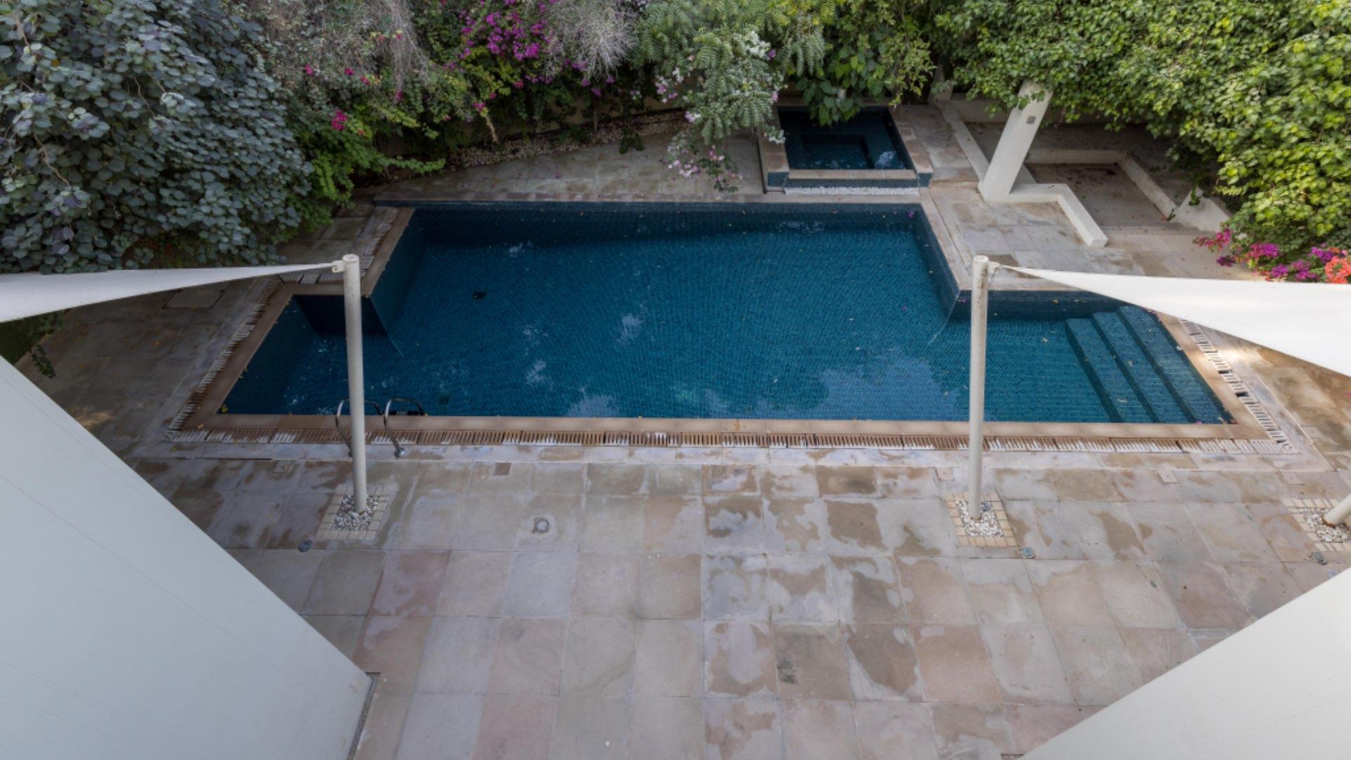 Private pool surrounded by lush greenery at Al Barari Villa, perfect for relaxation