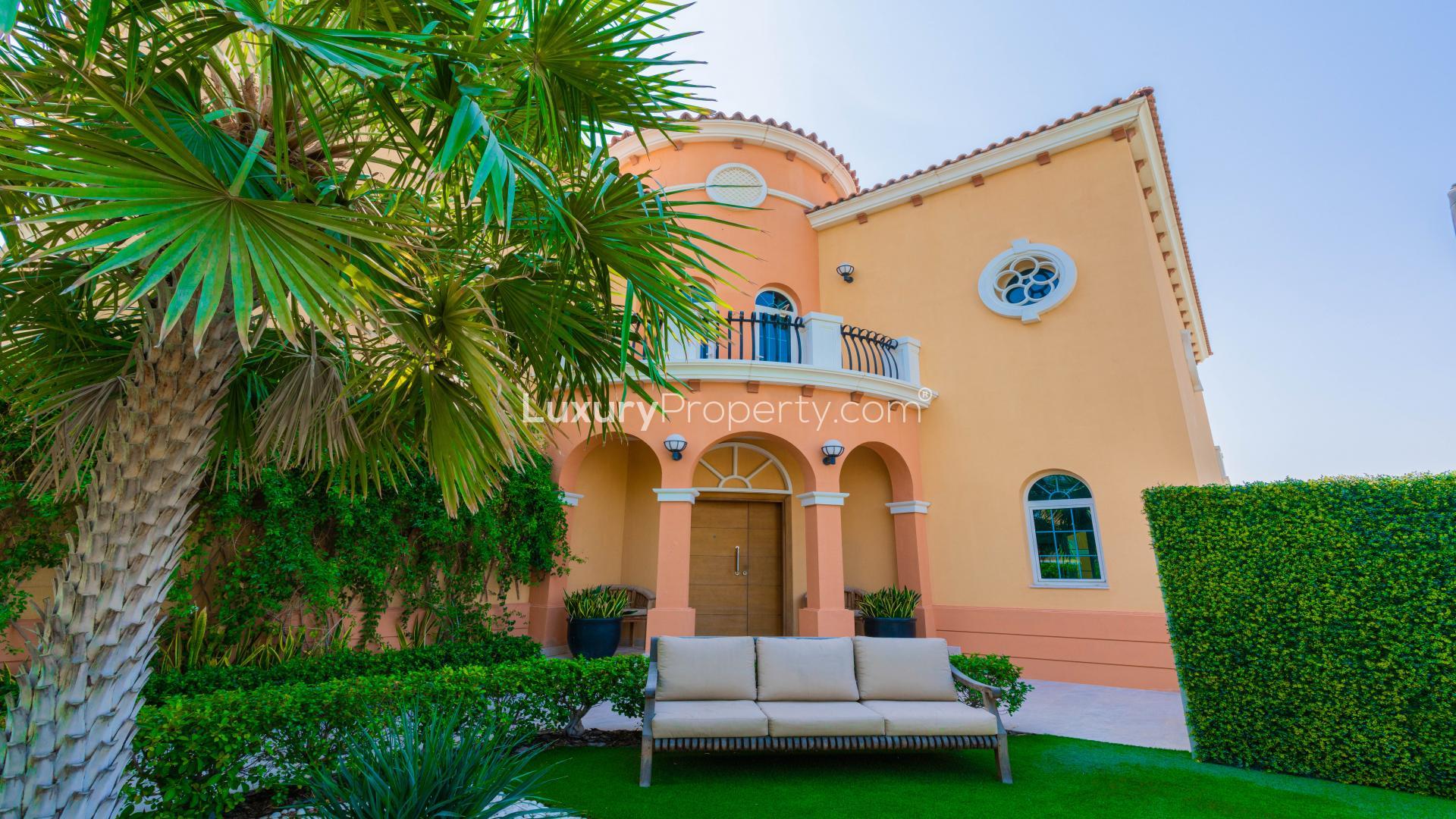 Beautiful Jumeirah Park villa with private pool, lush garden, and spacious patio for sale
