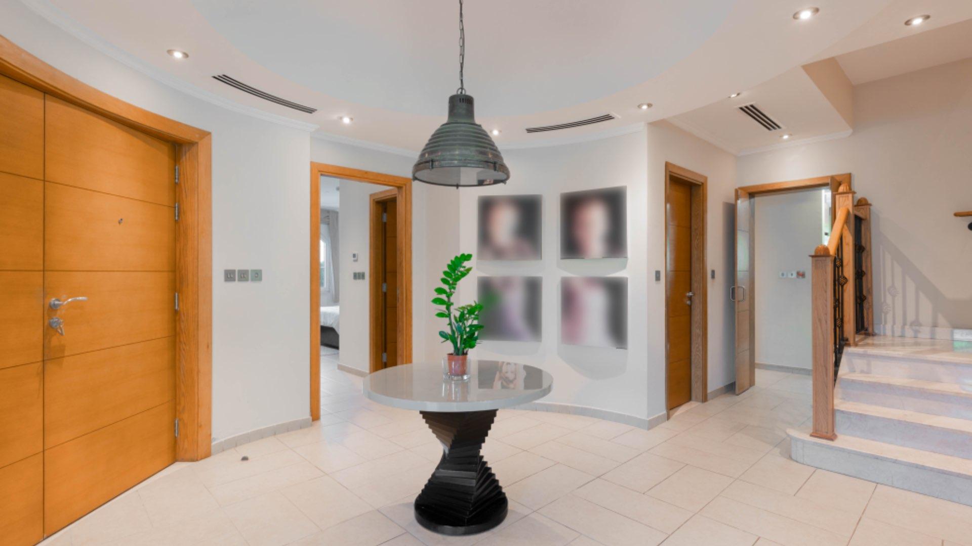 Beautiful villa exterior with lush garden in Jumeirah Park Legacy community, Ref LP15175