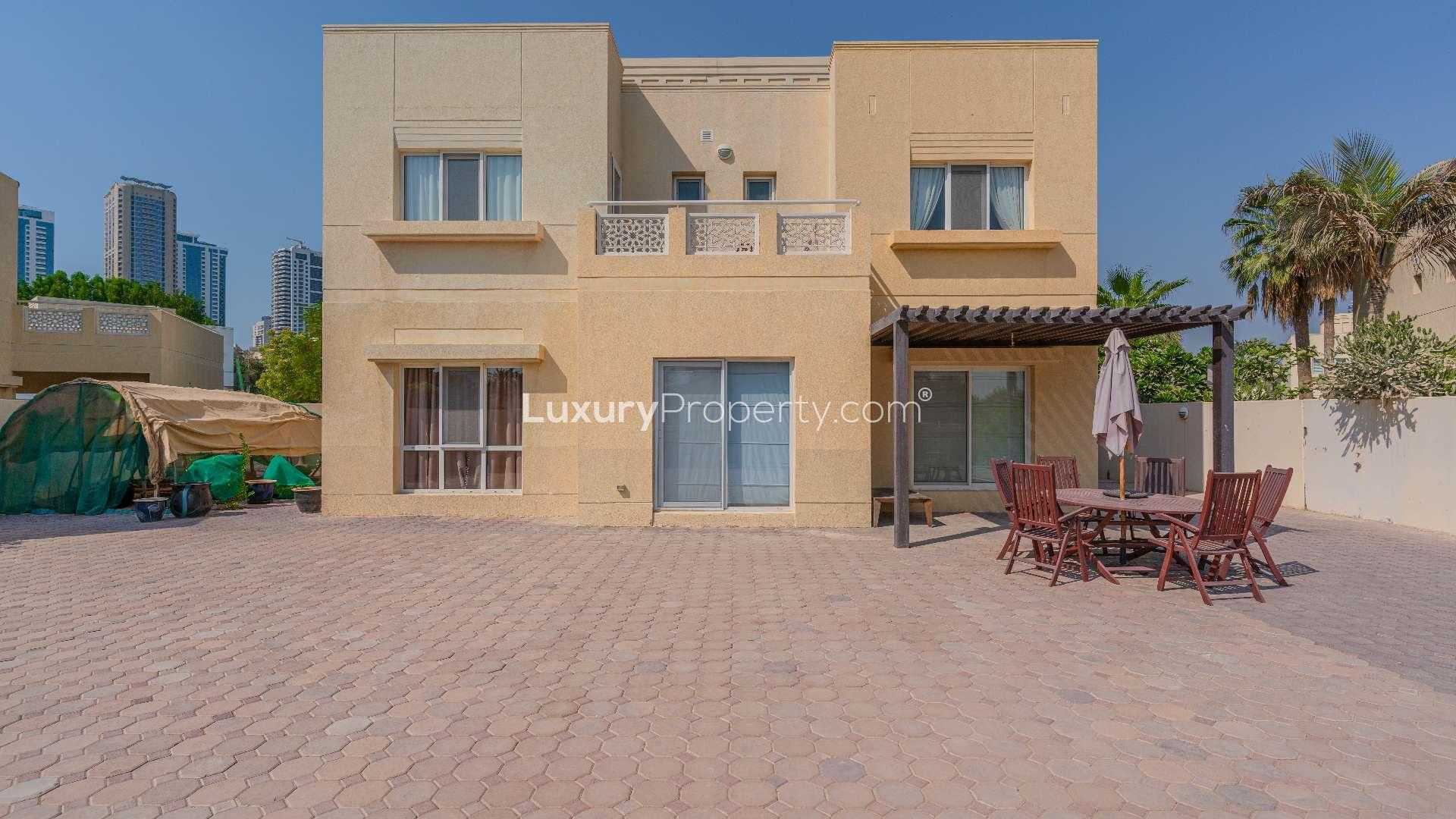 Lake view from spacious villa in Meadows 2, Dubai, surrounded by lush greenery