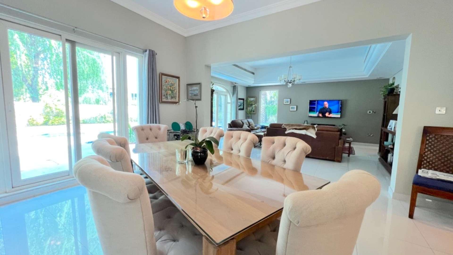 Spacious living room in upgraded C1 villa, Victory Heights, Dubai Sports City, with pool view