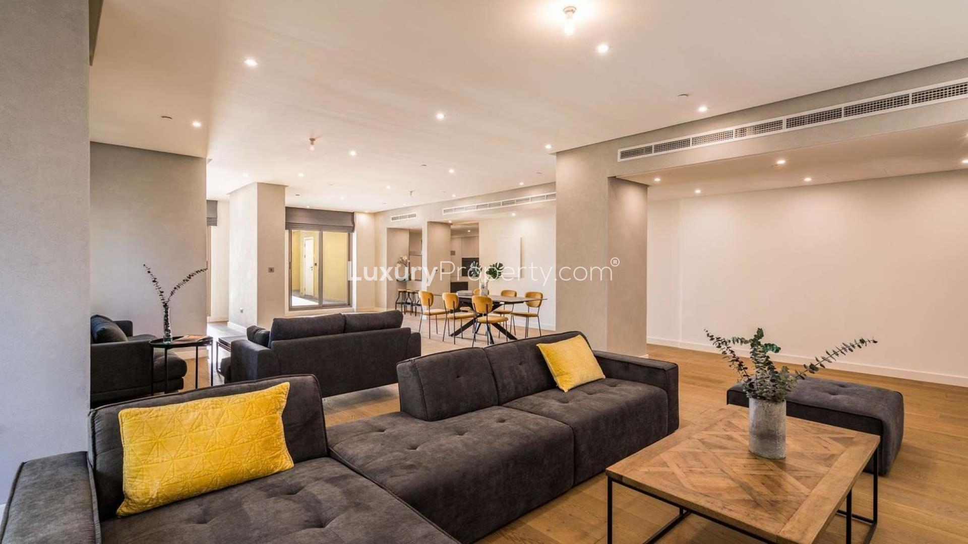 Luxurious JBR penthouse living room with modern furniture and bright decor