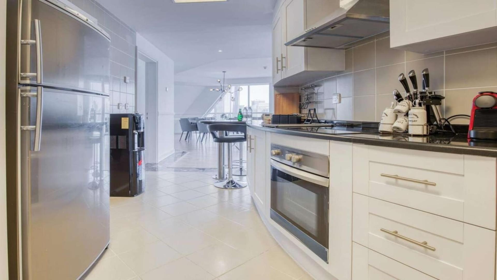 Luxurious living area in 5-bedroom duplex penthouse, Dubai Marina, modern decor and spacious layout