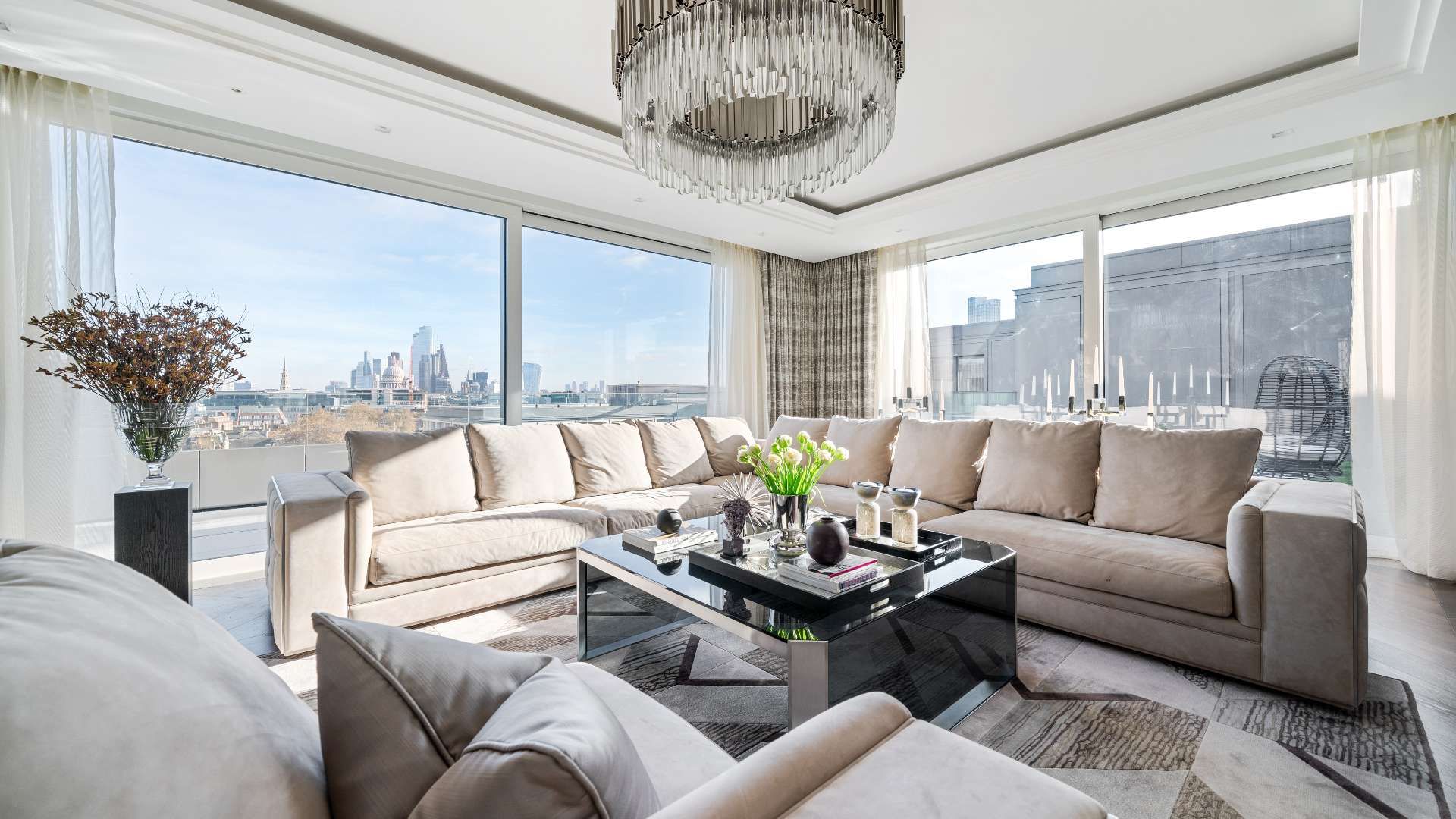 Penthouse terrace with panoramic London skyline views, featuring modern outdoor seating