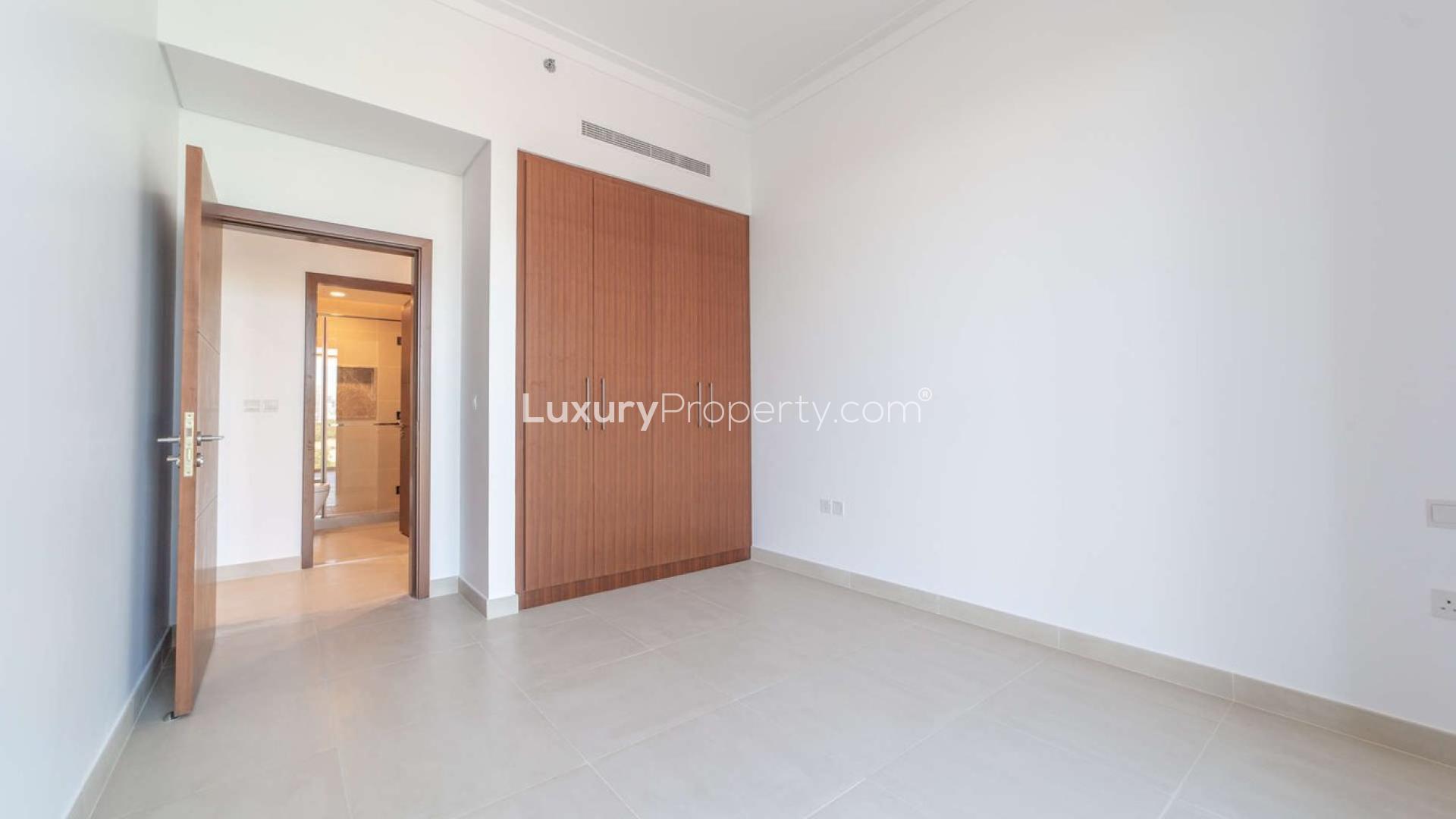 Luxury apartment balcony with city skyline and golf course views, The Hills C