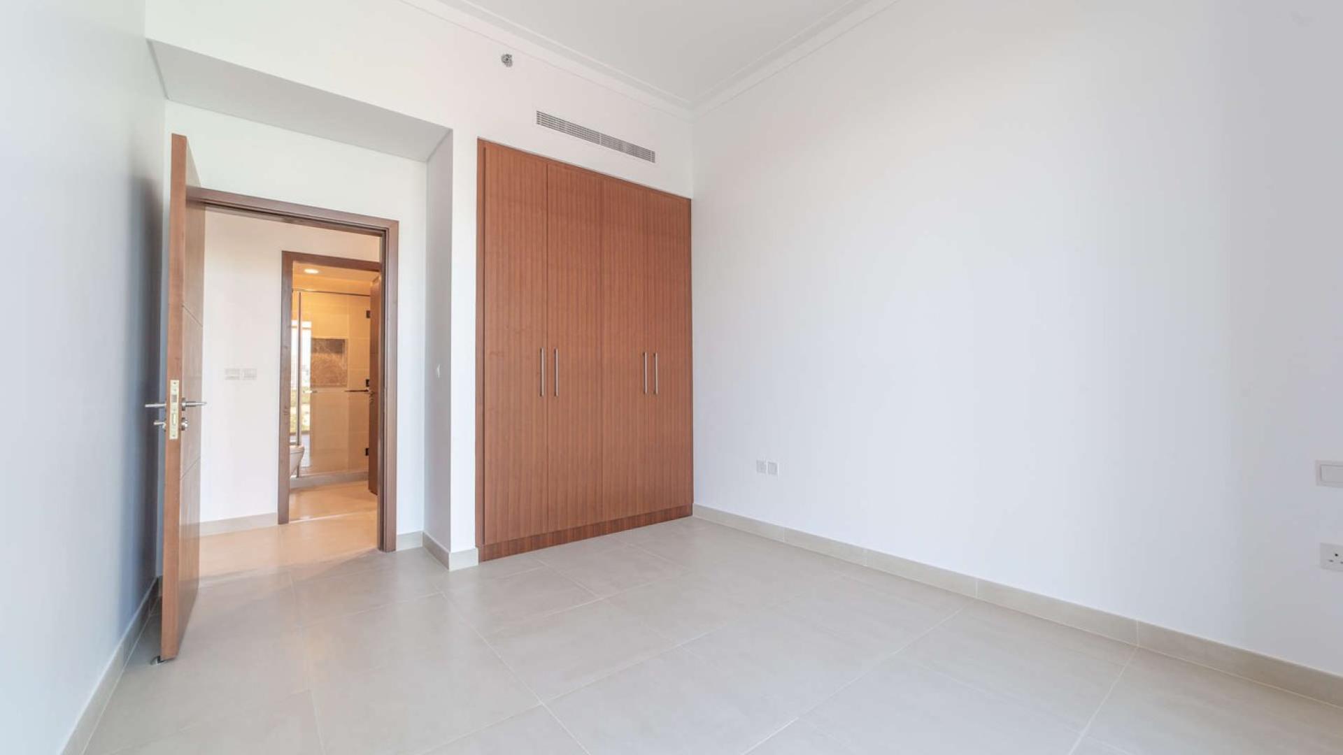 Luxury apartment balcony with city skyline and golf course views, The Hills C