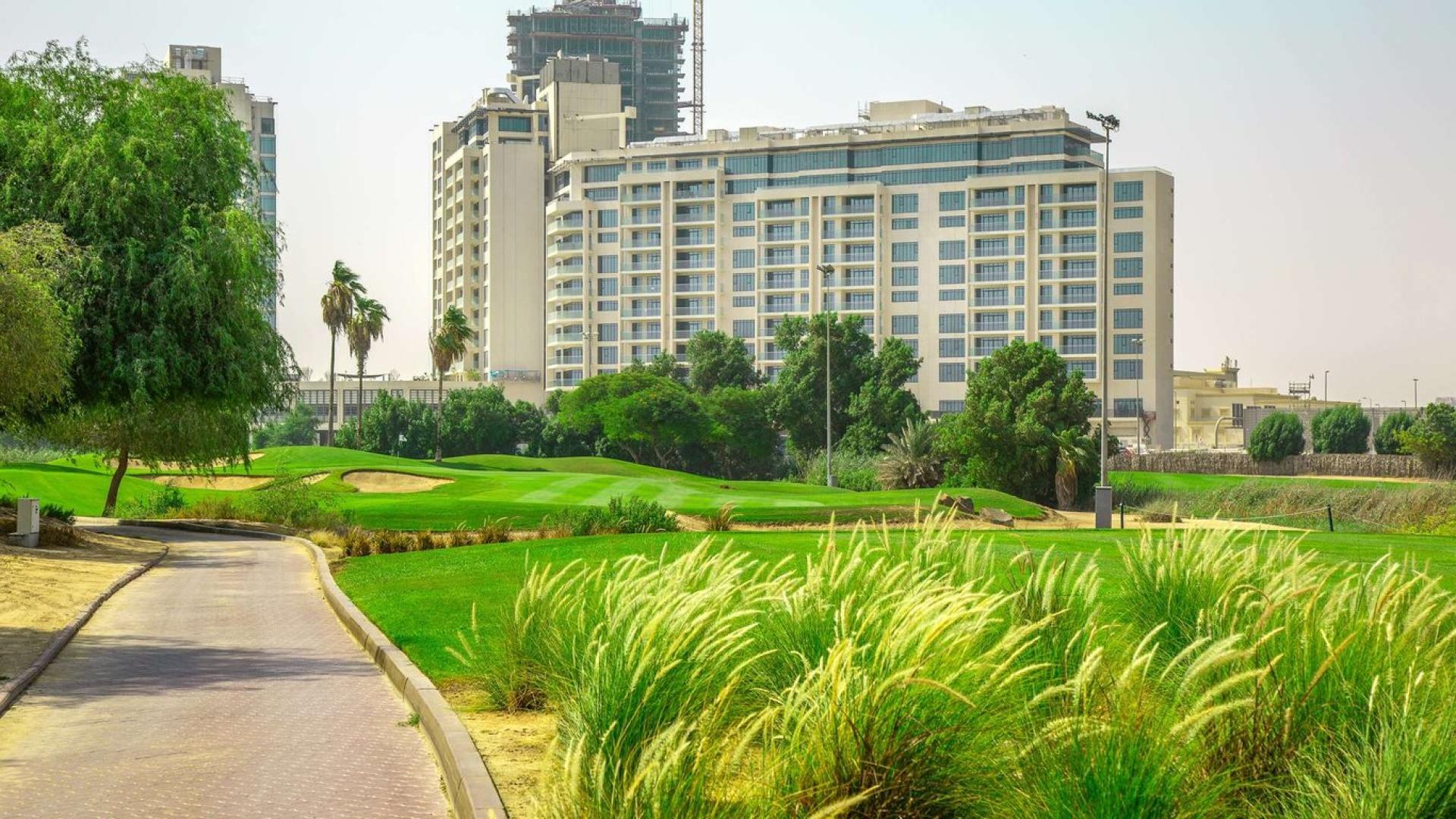 Empty penthouse room with large windows and stunning golf course views, The Hills C