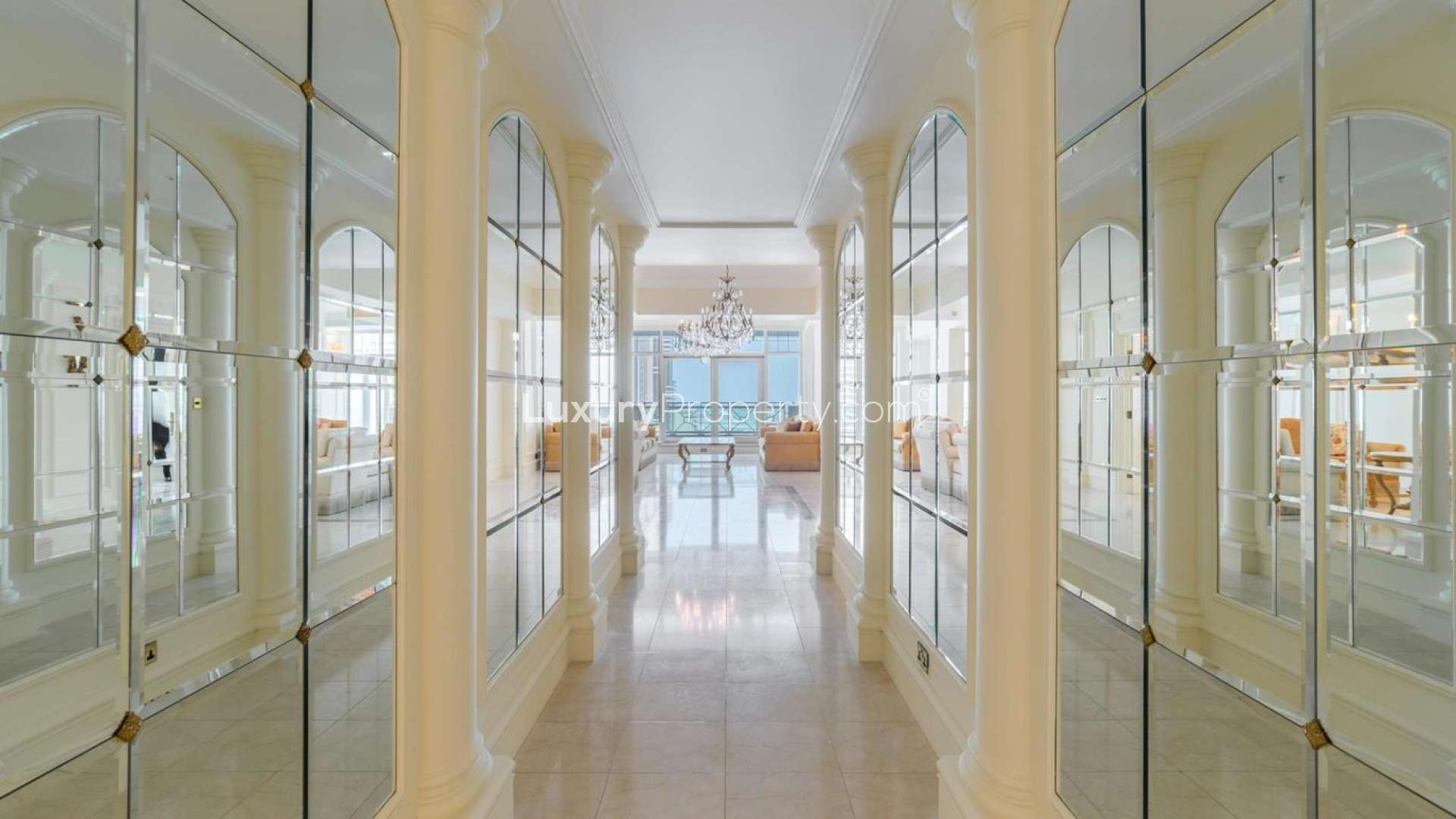 "Stunning view from duplex penthouse balcony in Al Anbar Tower, Dubai Marina.",Luxurious hallway with mirrored walls in Dubai Marina penthouse, Al Anbar Tower