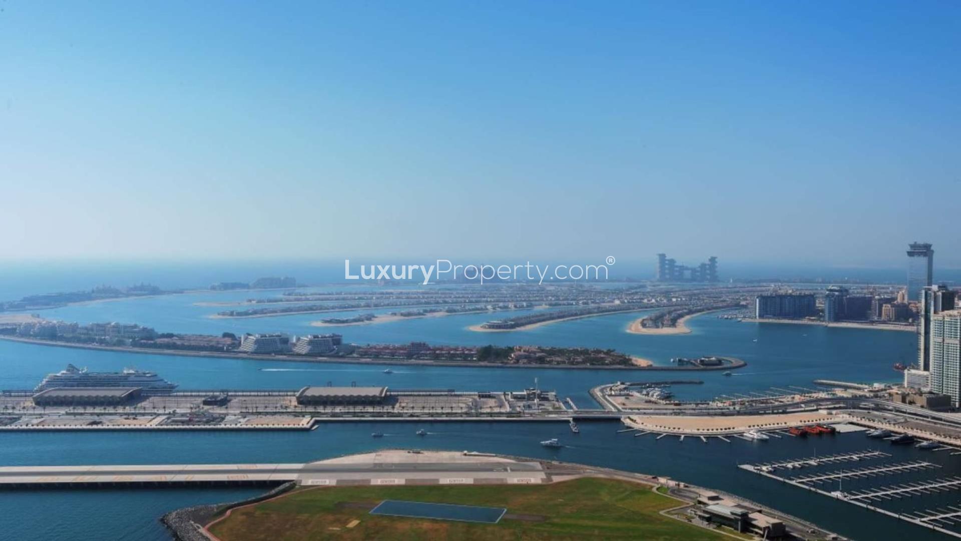 Duplex penthouse interior with ocean views, featuring modern staircase and expansive windows, 1 JBR