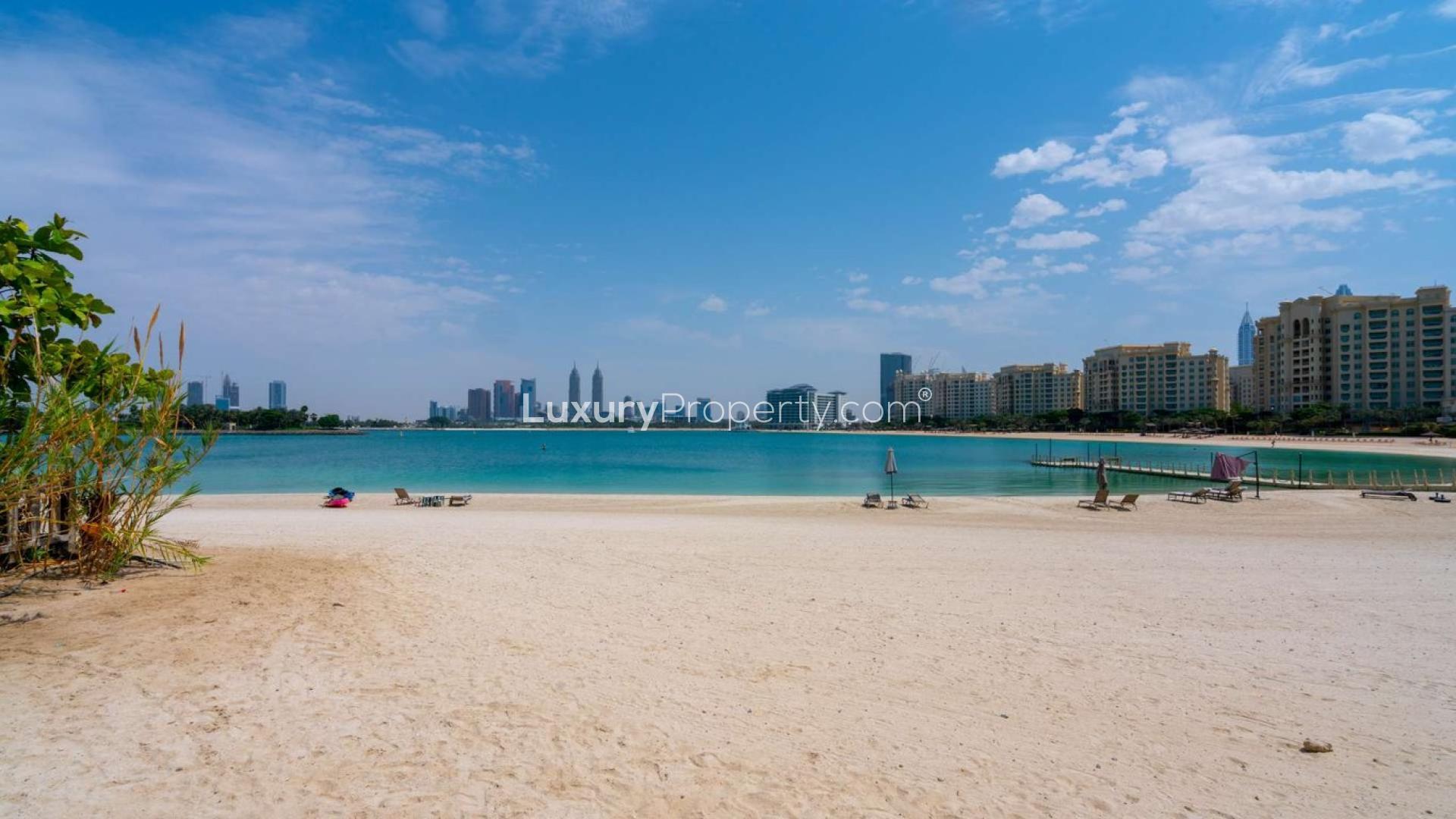 Palm Jumeirah townhouse with upgraded layout, sea view, and lush landscaping for sale