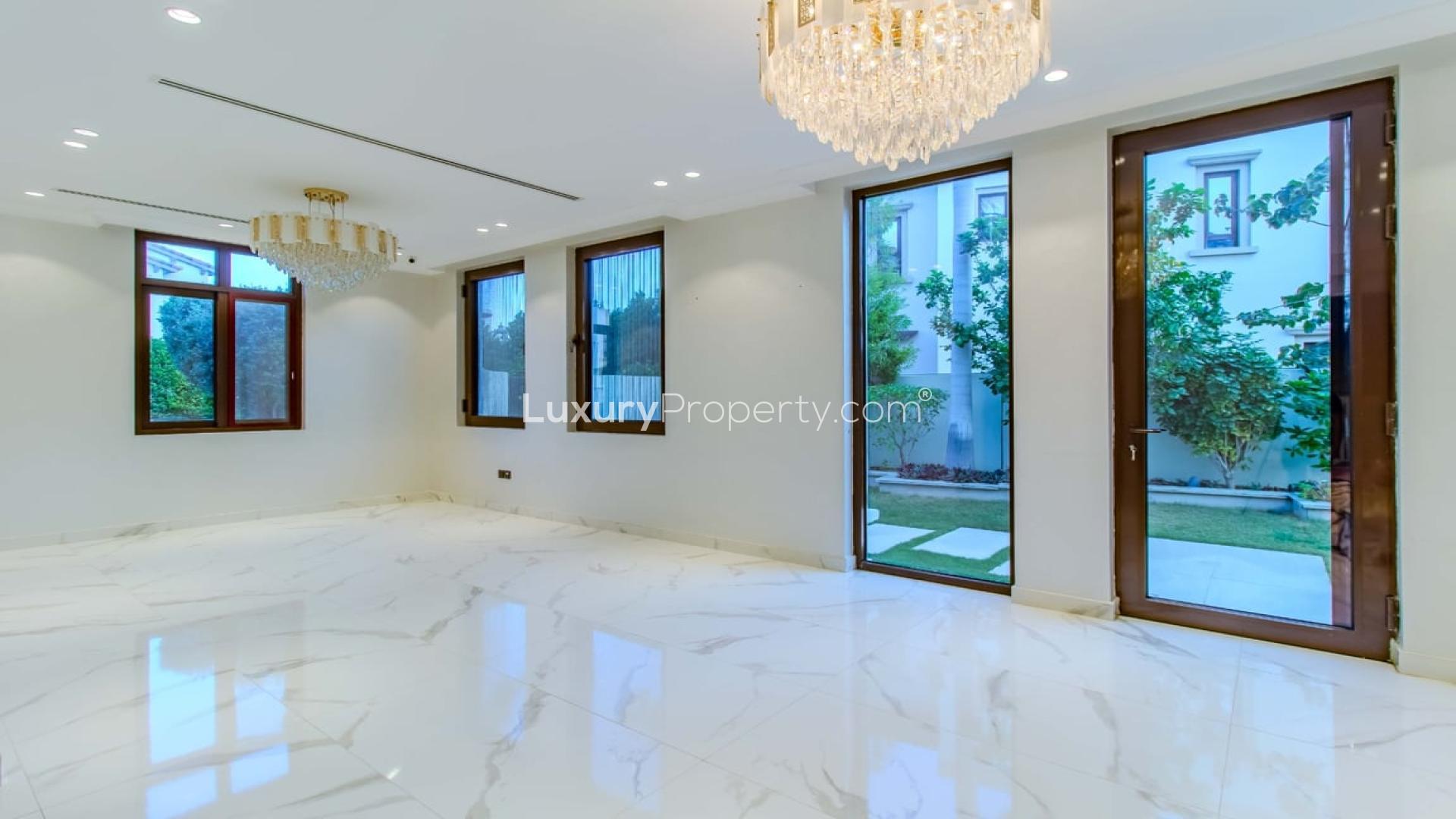 Luxurious villa interior with marble floors and garden view in Arabian Ranches 2