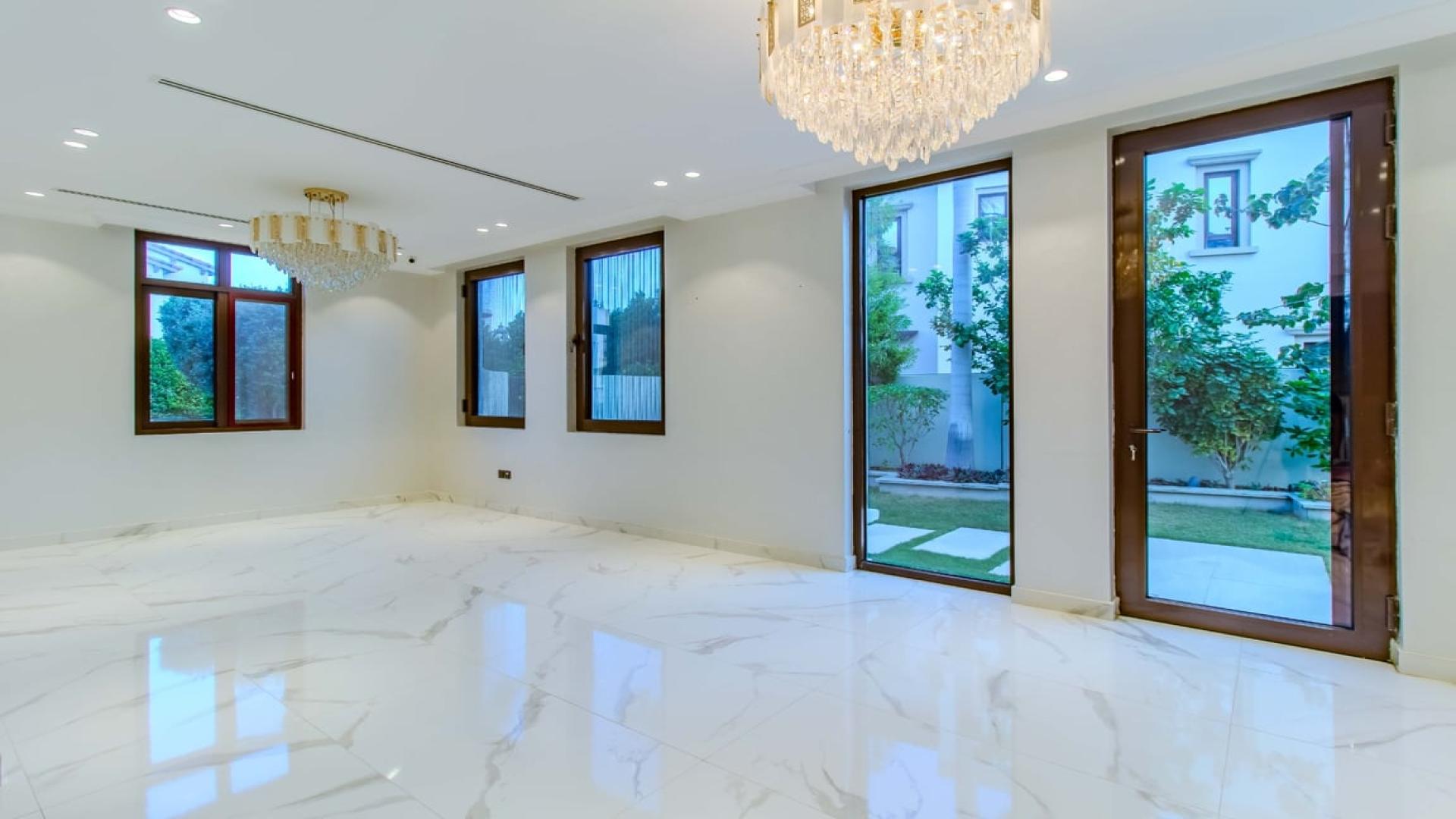 Luxurious villa interior with marble floors and garden view in Arabian Ranches 2
