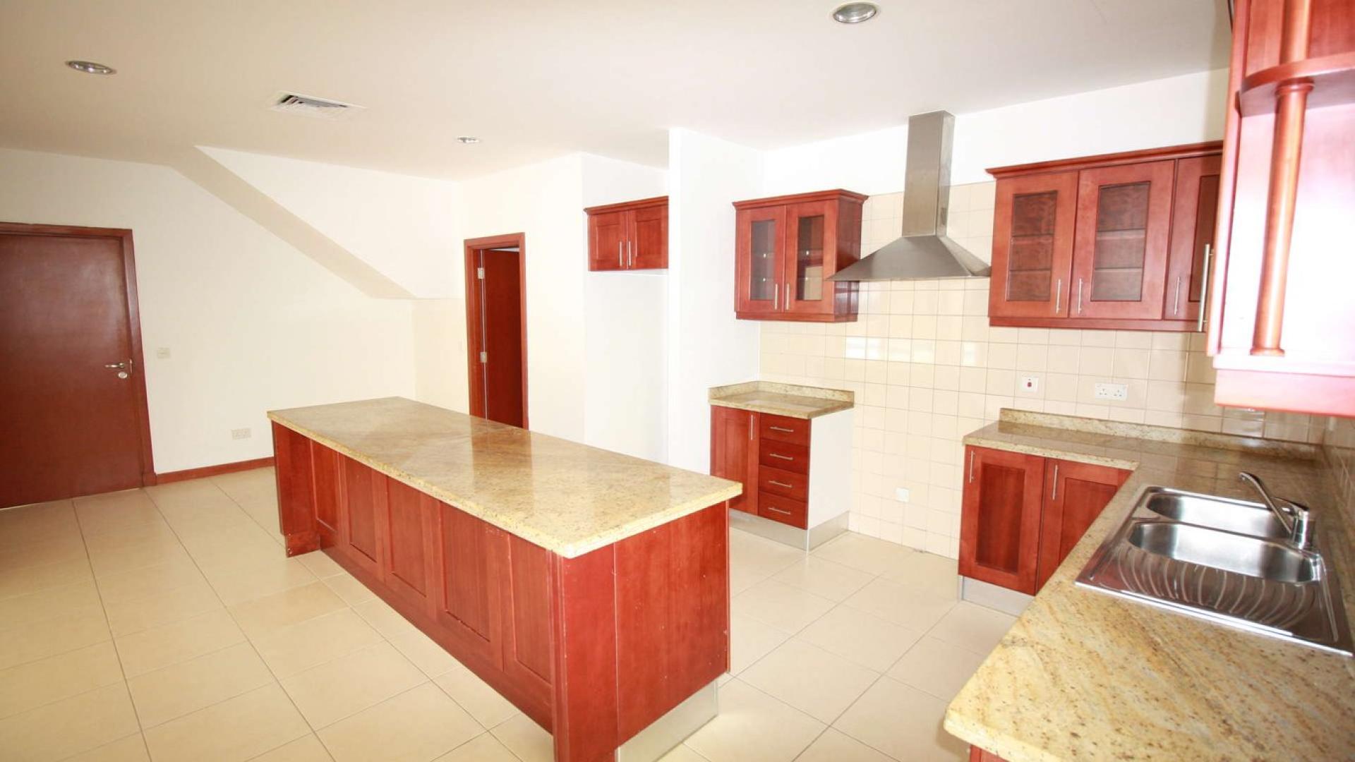 Bright room with large windows and built-in wooden closet in Saheel villa, Arabian Ranches