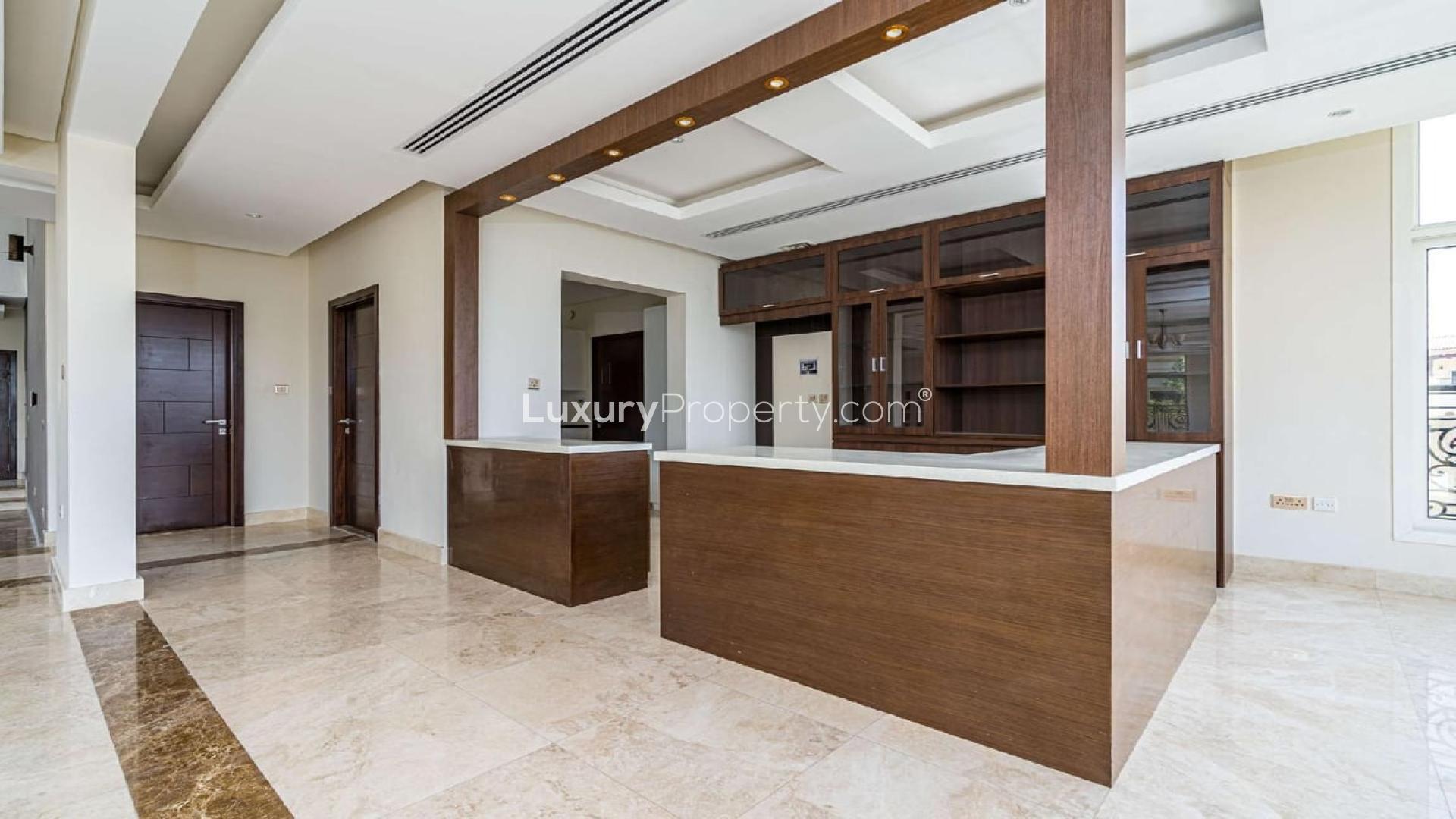Spacious living area with marble floors in Jumeirah Golf Estates villa for rent