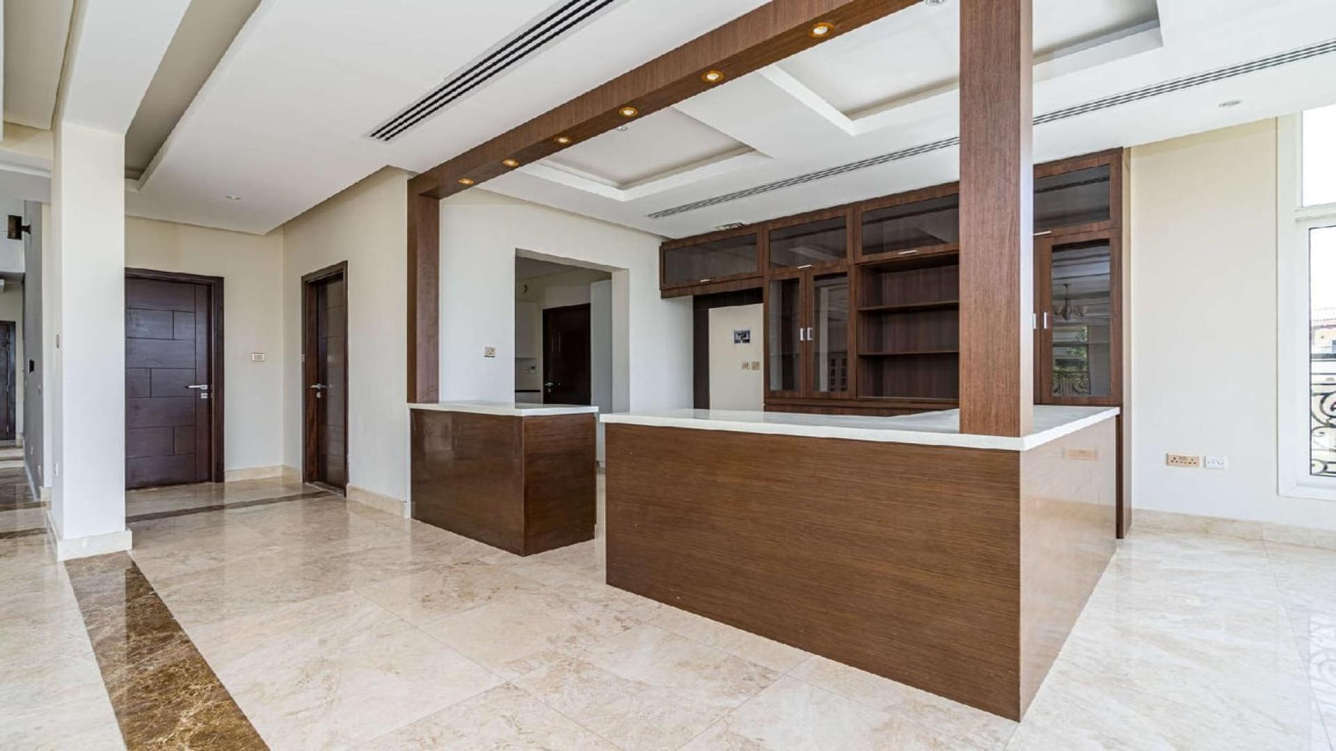 Spacious living area with marble floors in Jumeirah Golf Estates villa for rent