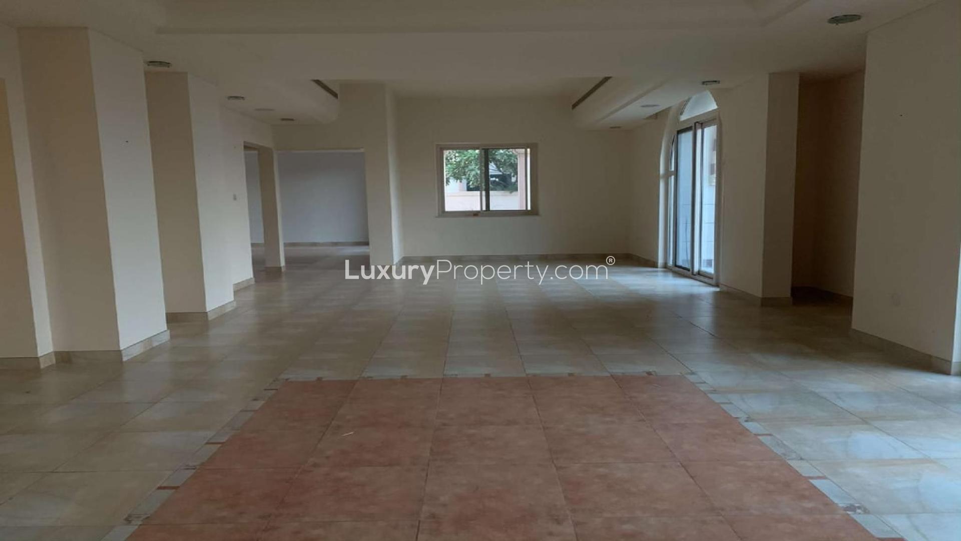 Window view from 5-bedroom villa in Victory Heights, Dubai, overlooking golf course