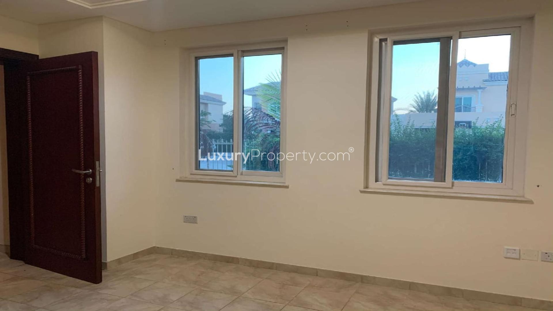 5-bedroom villa exterior in Victory Heights, Dubai, with lush greenery and charming architecture