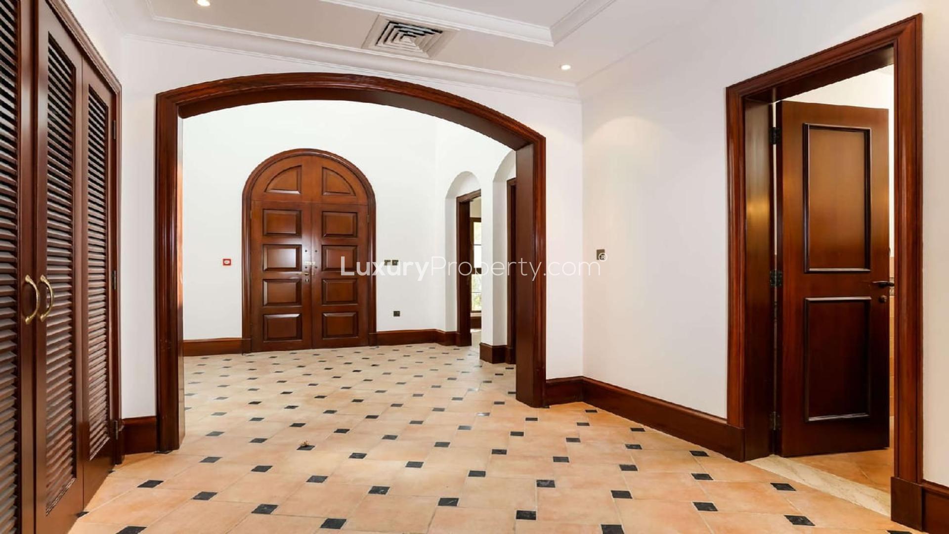 Entrance of 5-bedroom villa in Lime Tree Valley, Jumeirah Golf Estates, with stone facade