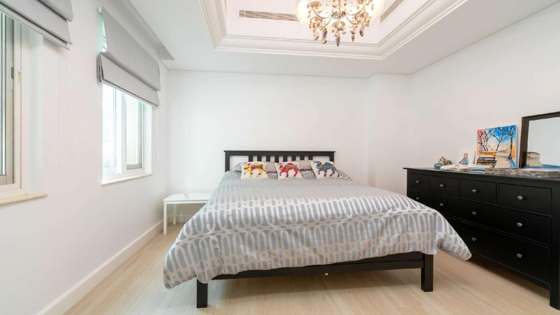 Elegant living room in upgraded Dubai Sports City villa, featuring modern decor and natural light