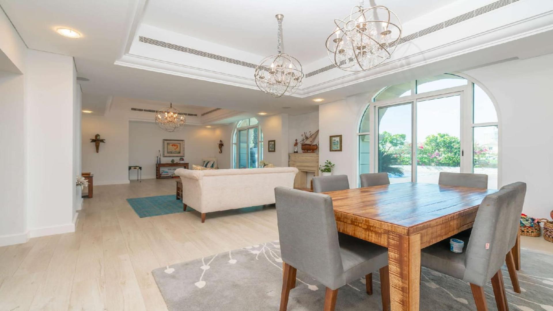 "Stunning Victory Heights villa with private pool and golf course view in Dubai Sports City.","Spacious living room in upgraded B1 villa, Victory Heights, Dubai Sports City, elegant décor.",Luxurious living room in fully upgraded Victory Heights villa, Dubai Sports City