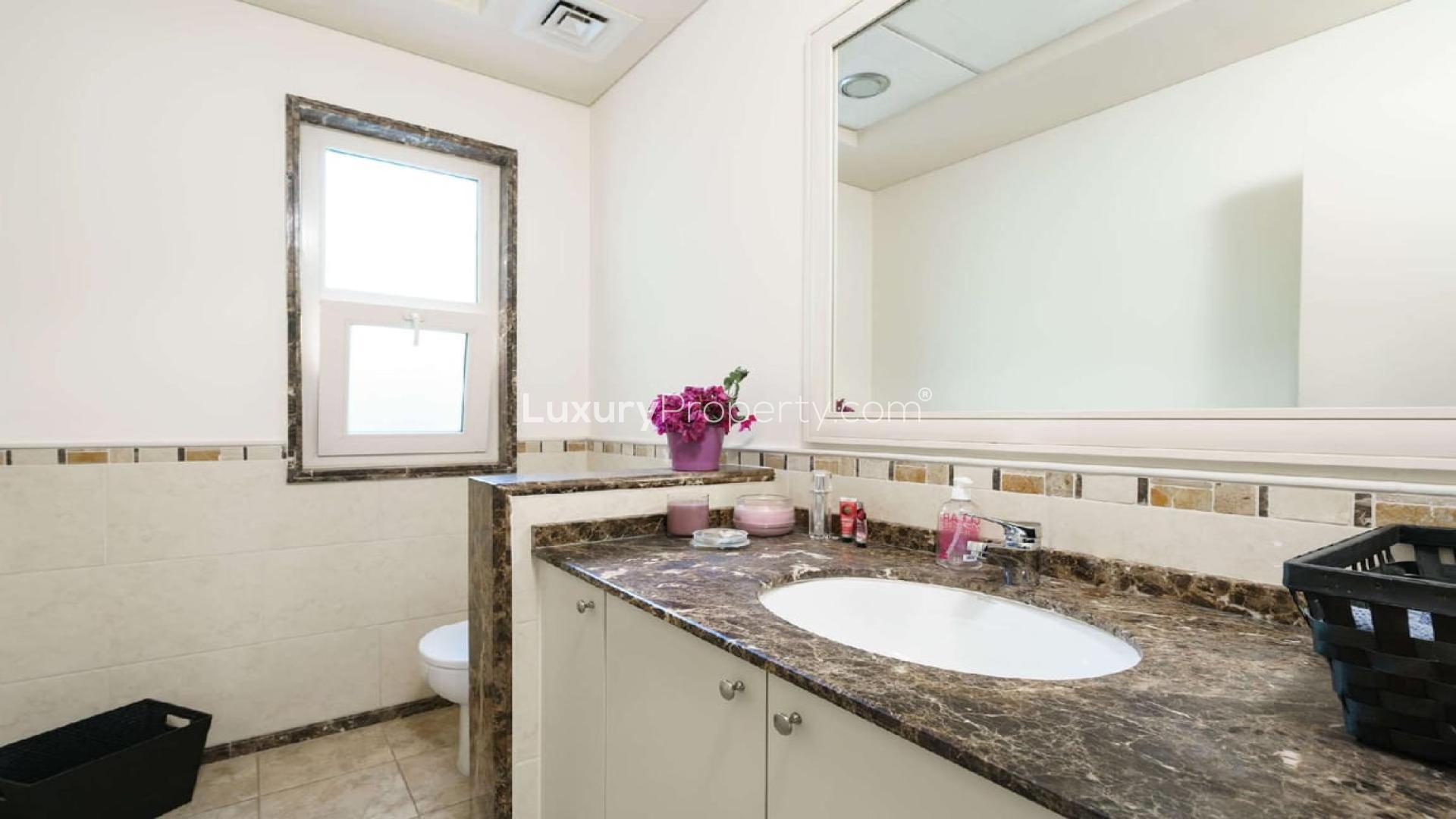 Bali-inspired villa patio with pool and lush garden in Victory Heights, Dubai