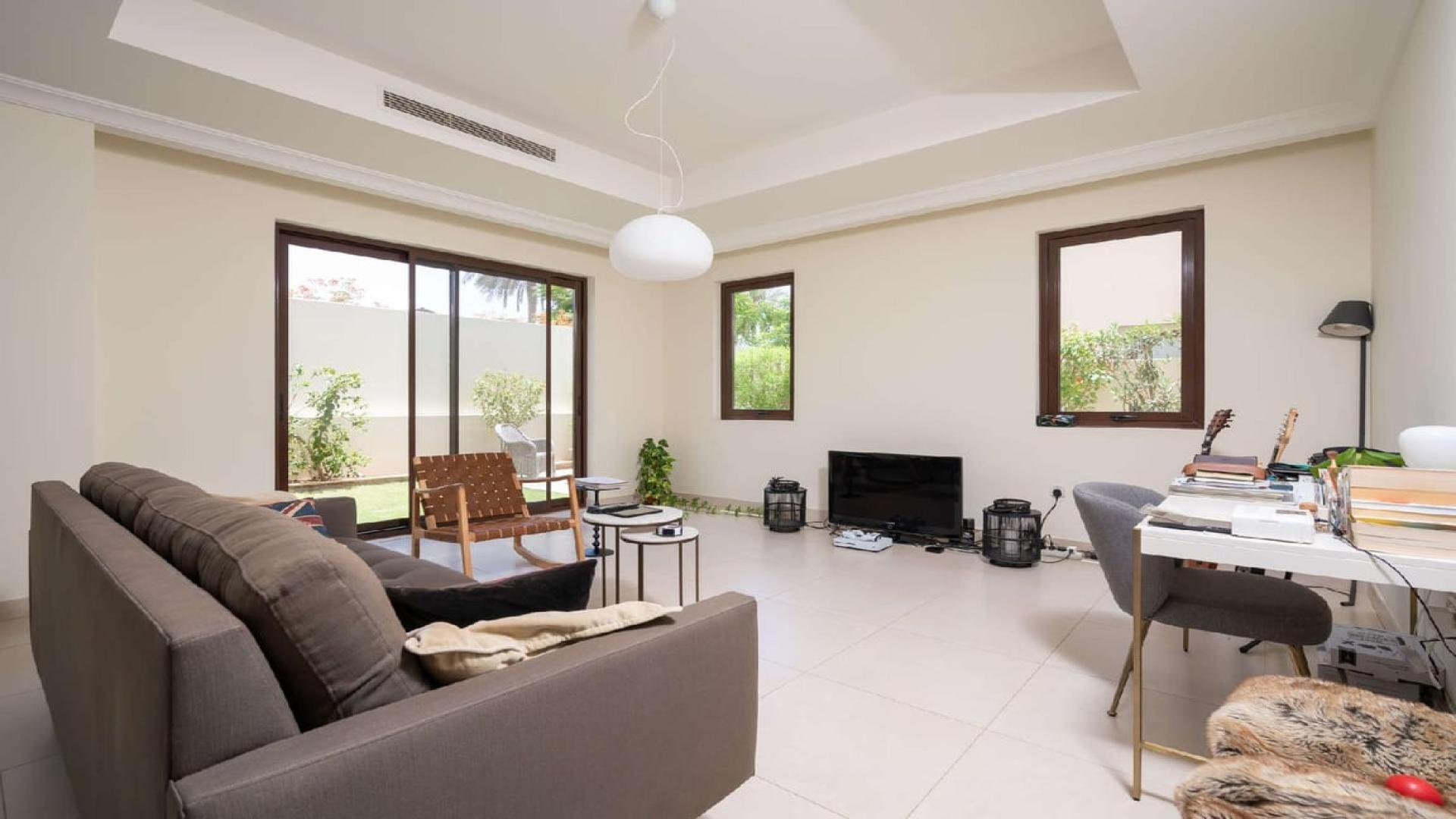 Spacious living room in 5-bedroom villa, Palma, Arabian Ranches 2, with garden view