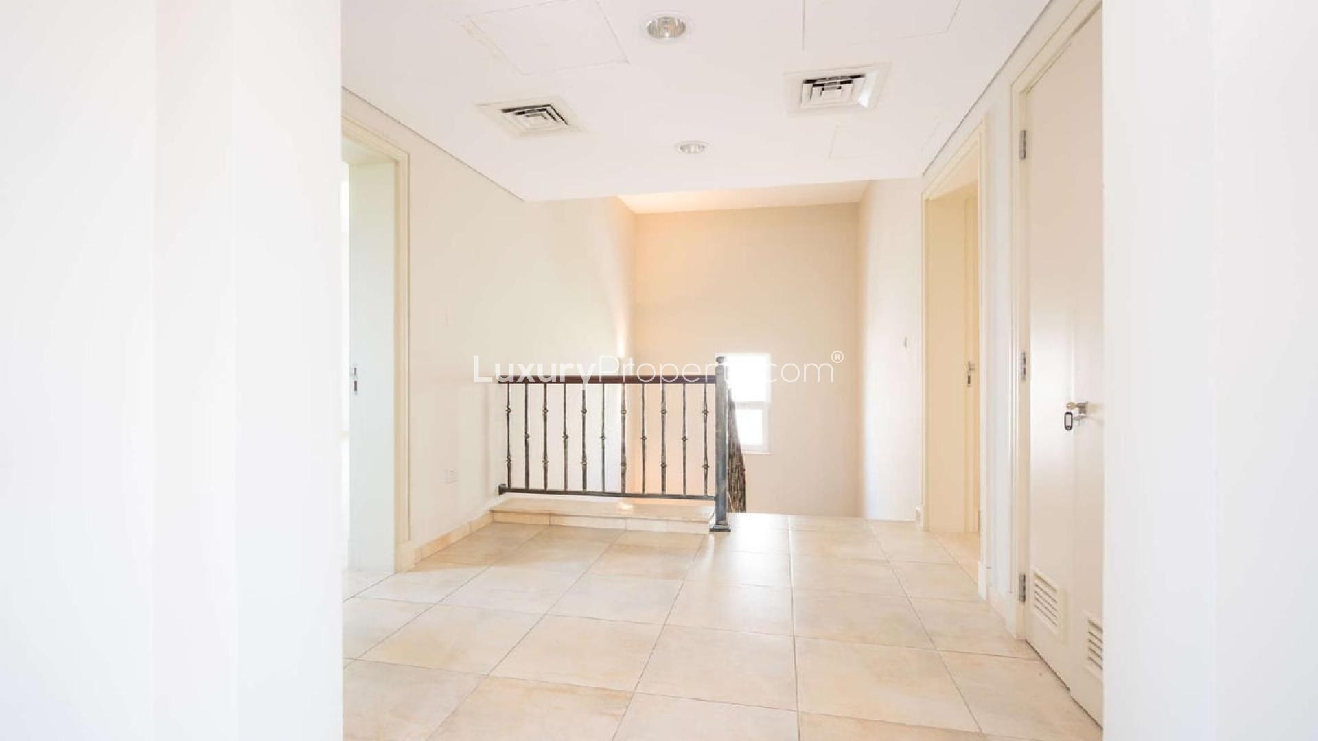 Bright living room with garden views in Victory Heights villa, Dubai Sports City