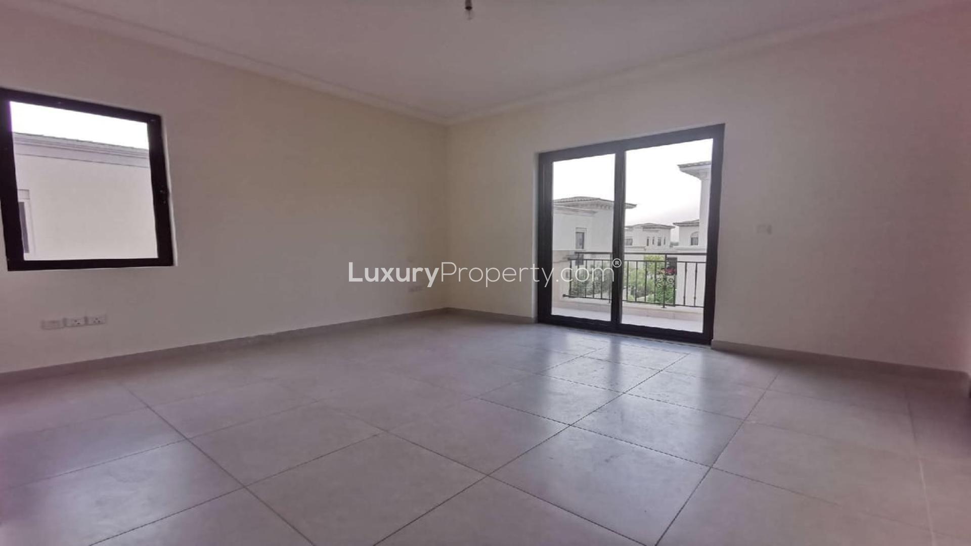 Empty bedroom with wooden closet and en-suite bathroom in Arabian Ranches 2 villa