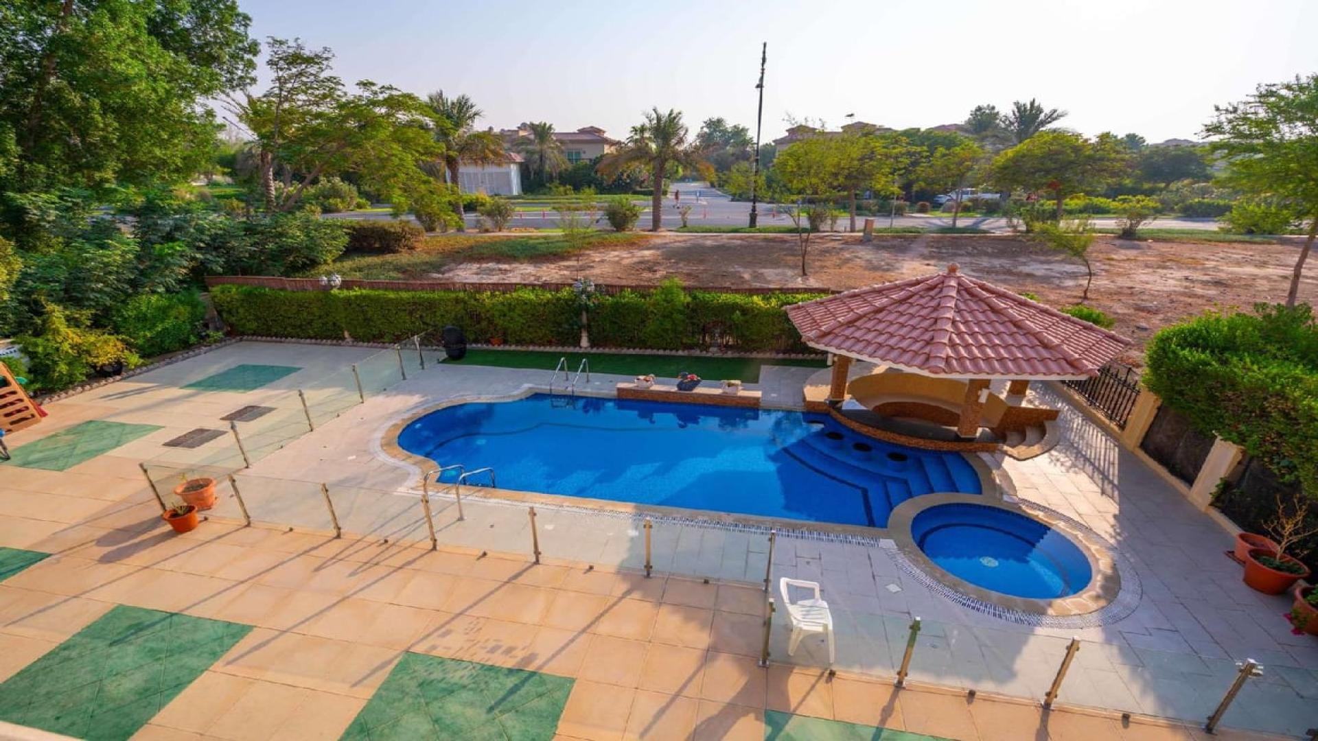 Front view of luxury 5-bedroom villa in Jumeirah Islands, European Clusters, with garden