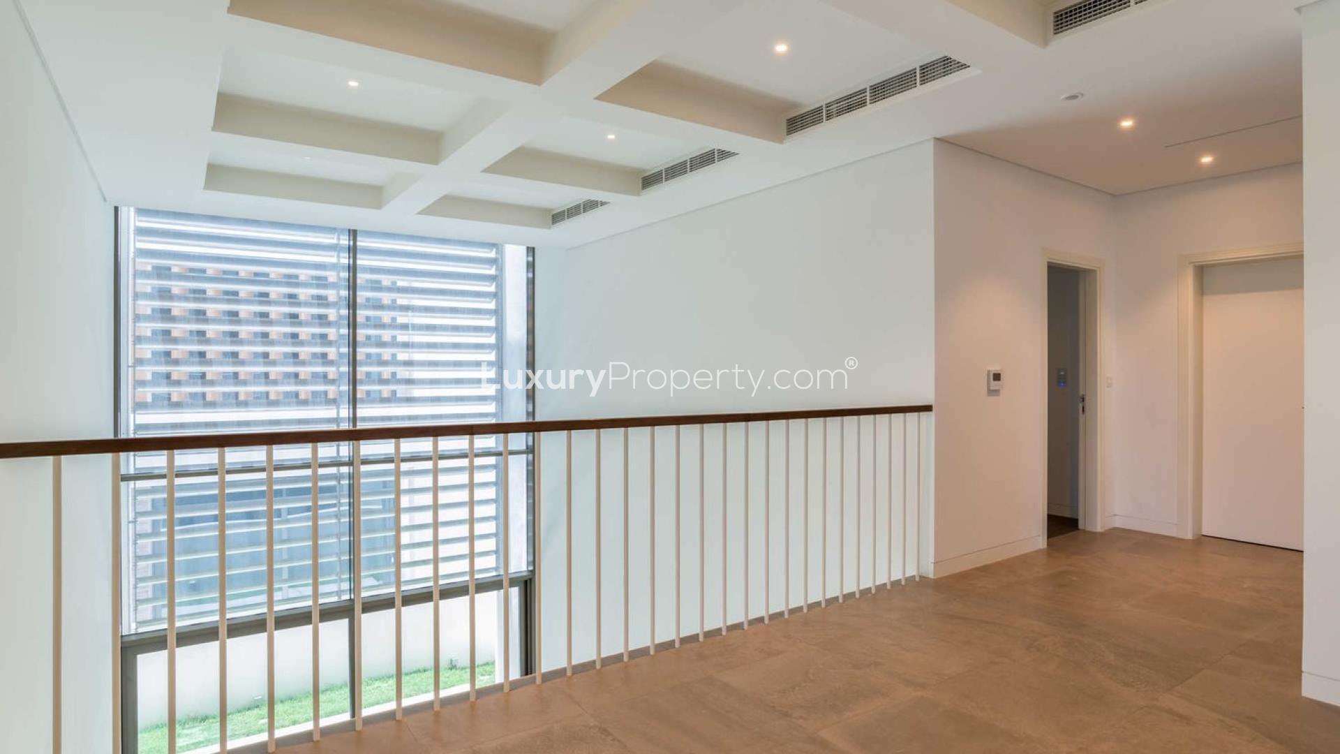 Luxury villa interior with sea view, large windows, and modern design on Palm Jebel Ali