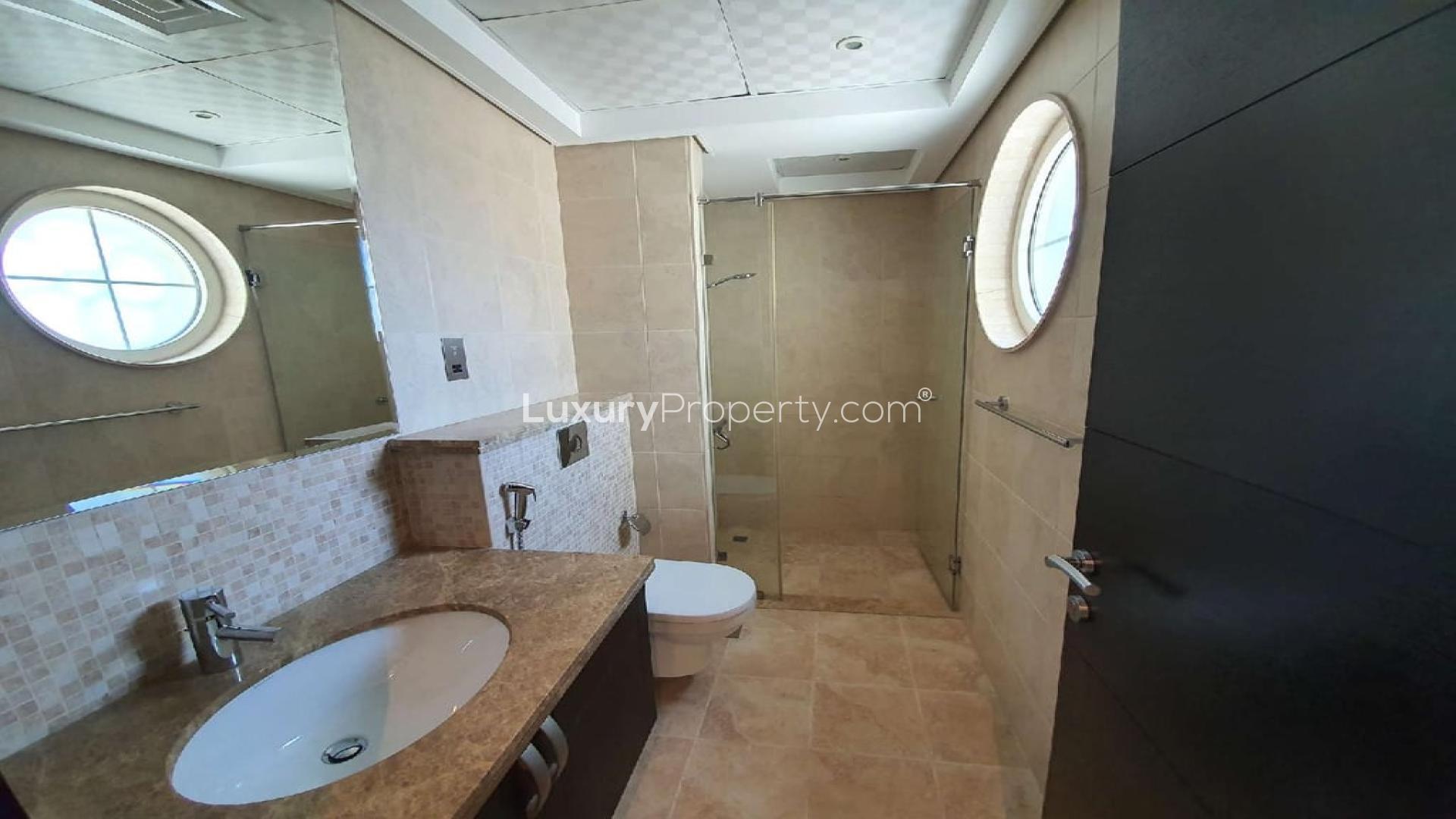 Exterior view of Legacy Villa in Jumeirah Park, featuring spacious driveway and garage