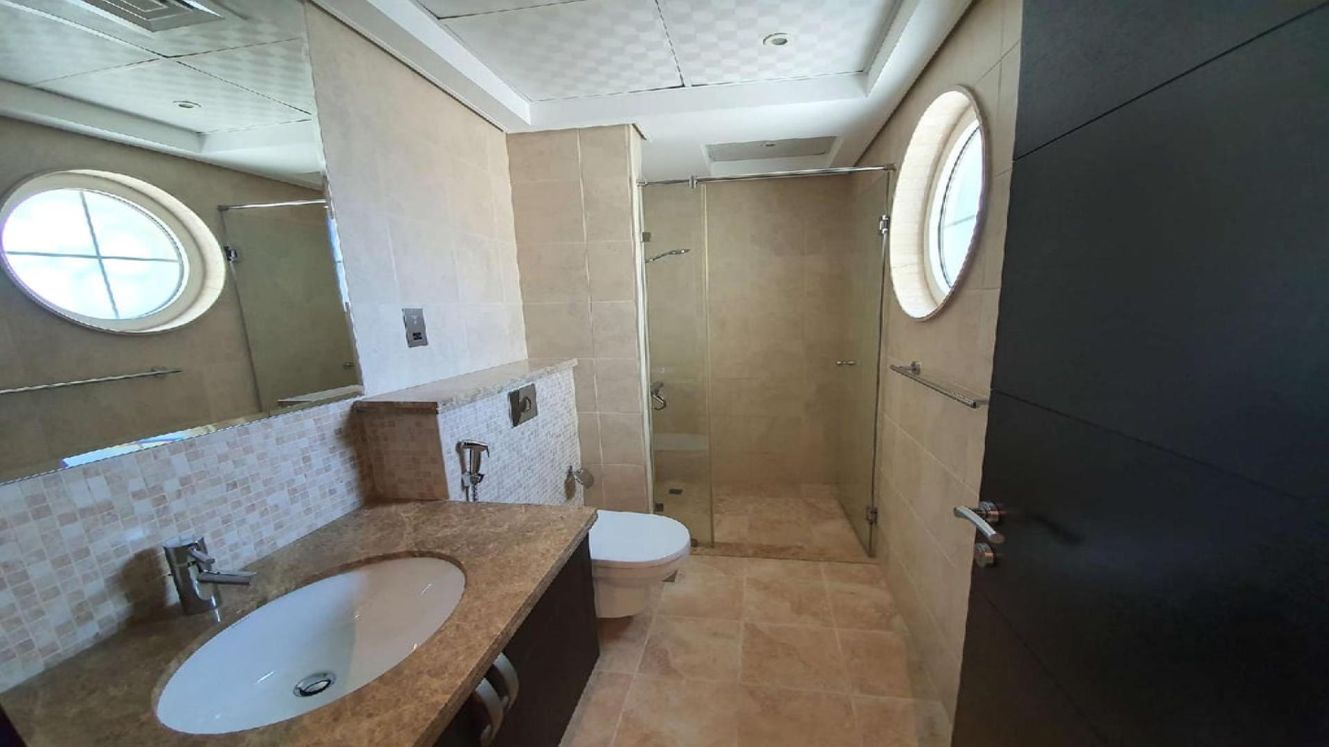 Exterior view of Legacy Villa in Jumeirah Park, featuring spacious driveway and garage