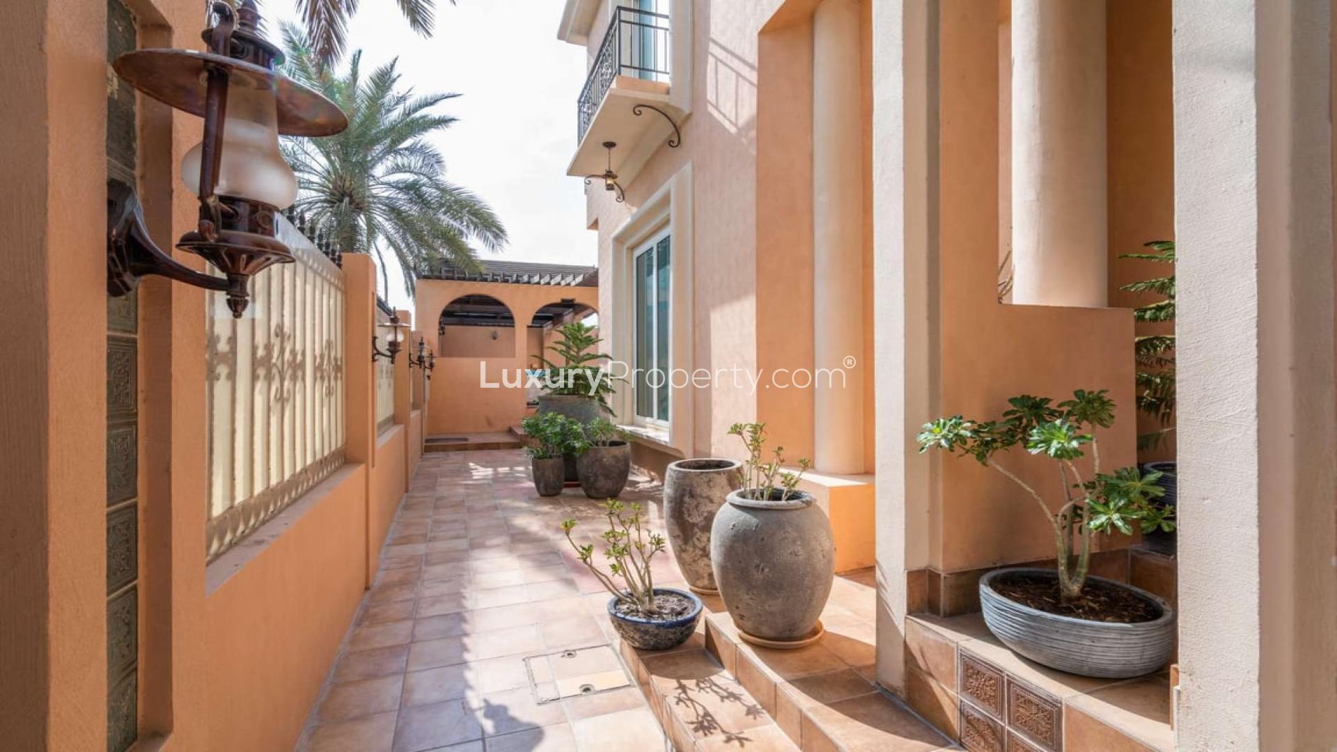 Mediterranean villa exterior with garden in Al Sufouh 1, available for rent