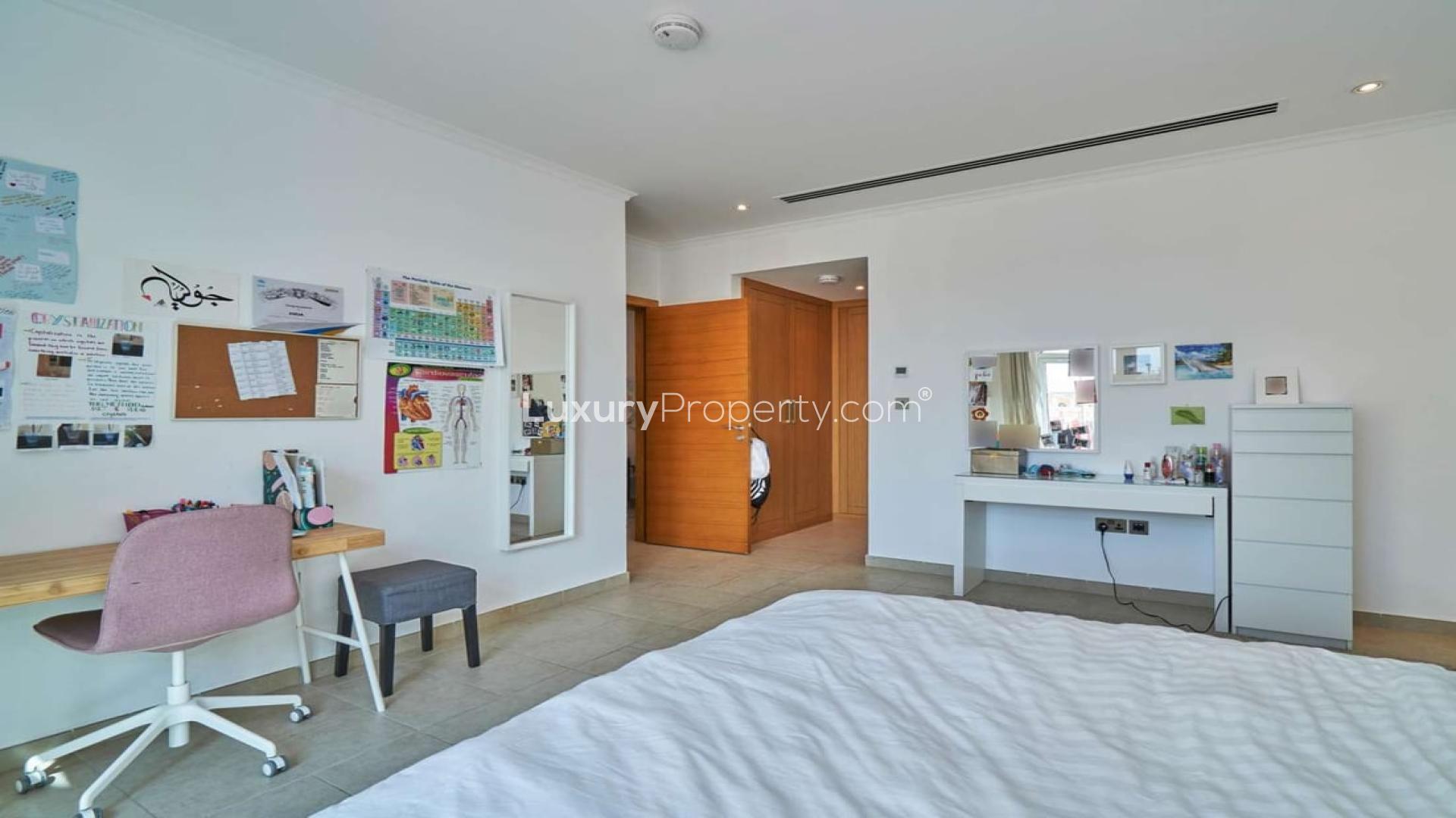 Spacious living room in 5-bedroom villa, Jumeirah Park, Legacy, with stylish decor and natural light