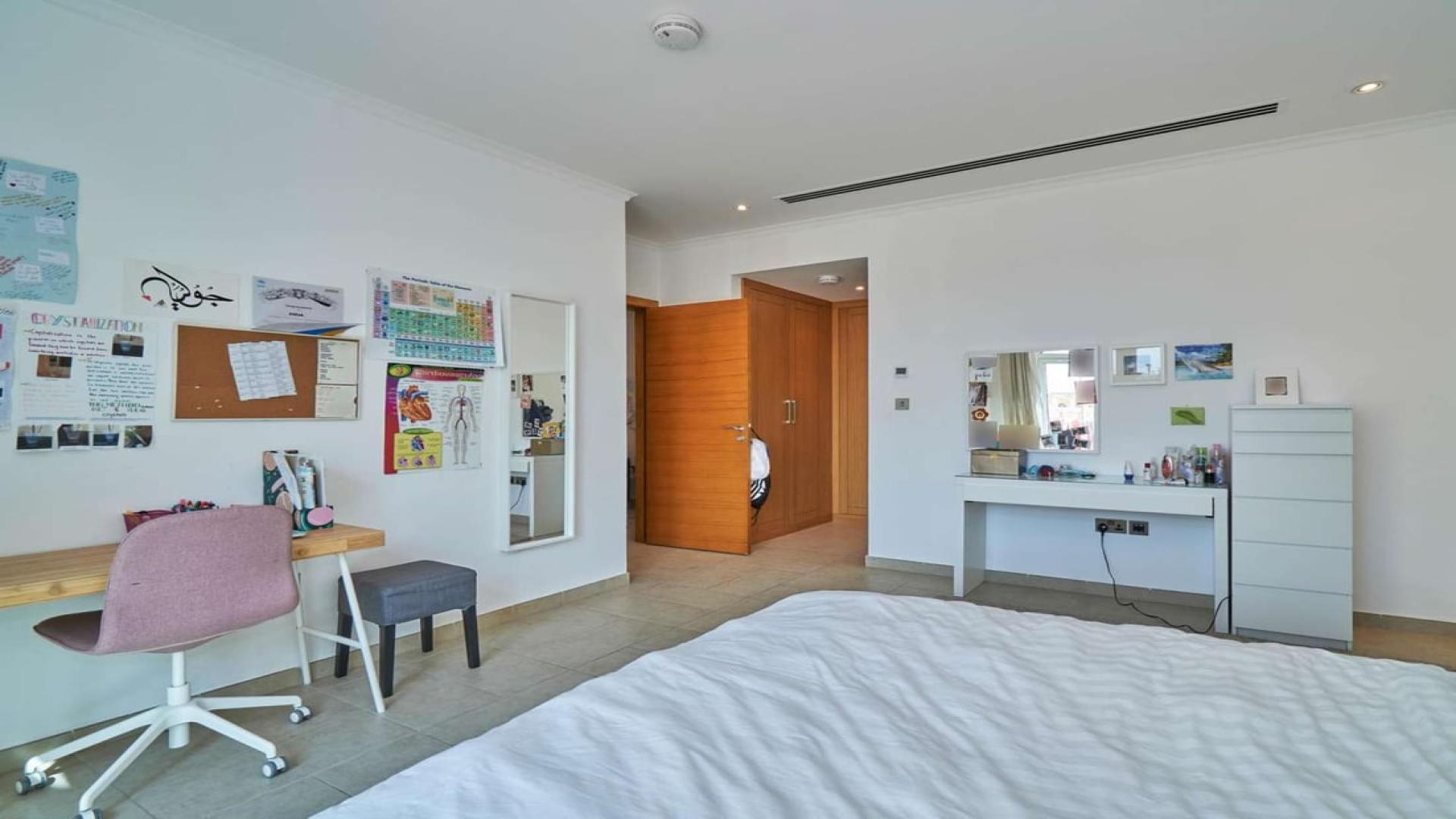 Spacious living room in 5-bedroom villa, Jumeirah Park, Legacy, with stylish decor and natural light