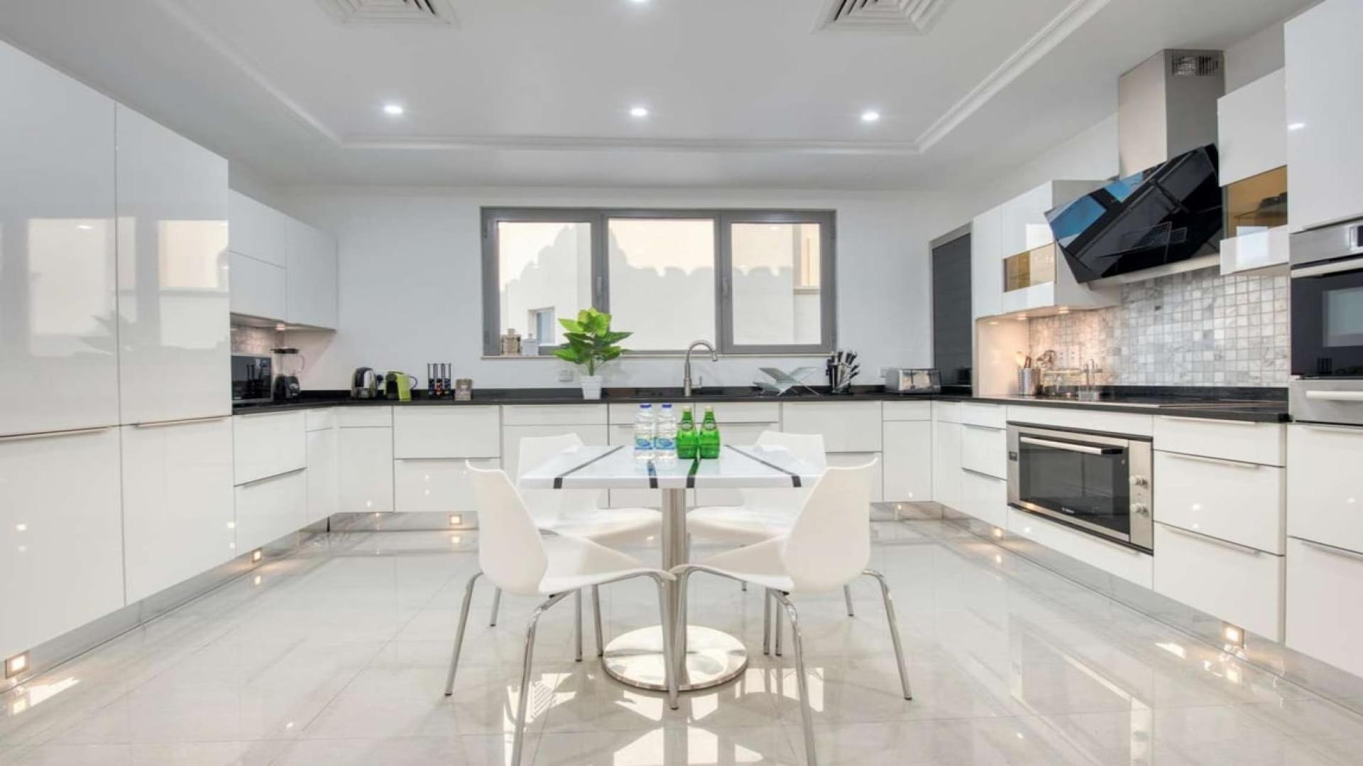 Luxurious living room in Palm Jumeirah Garden Homes villa with modern furnishings and sea view