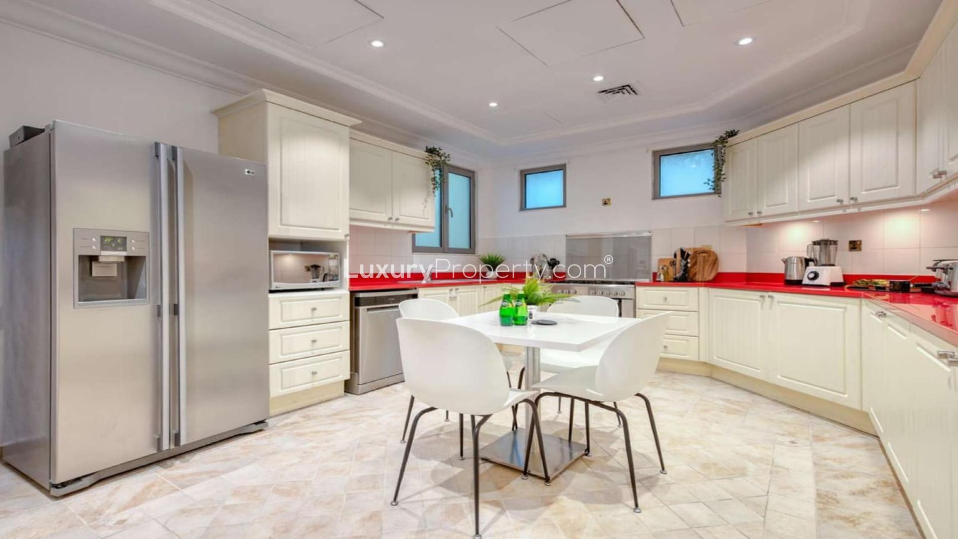 Luxurious living room in Palm Jumeirah villa with elegant decor and garden view