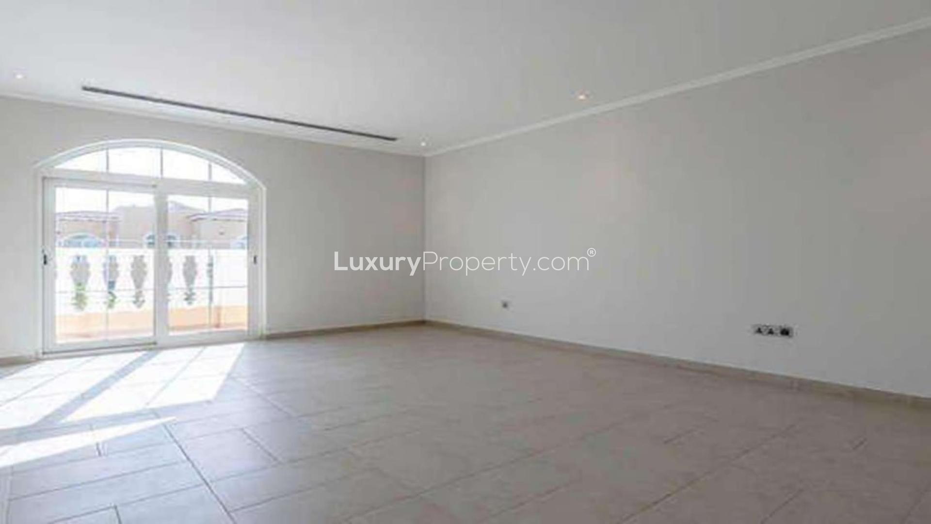 Exterior of spacious 5-bedroom Legacy Villa in Jumeirah Park, Dubai, with lush greenery