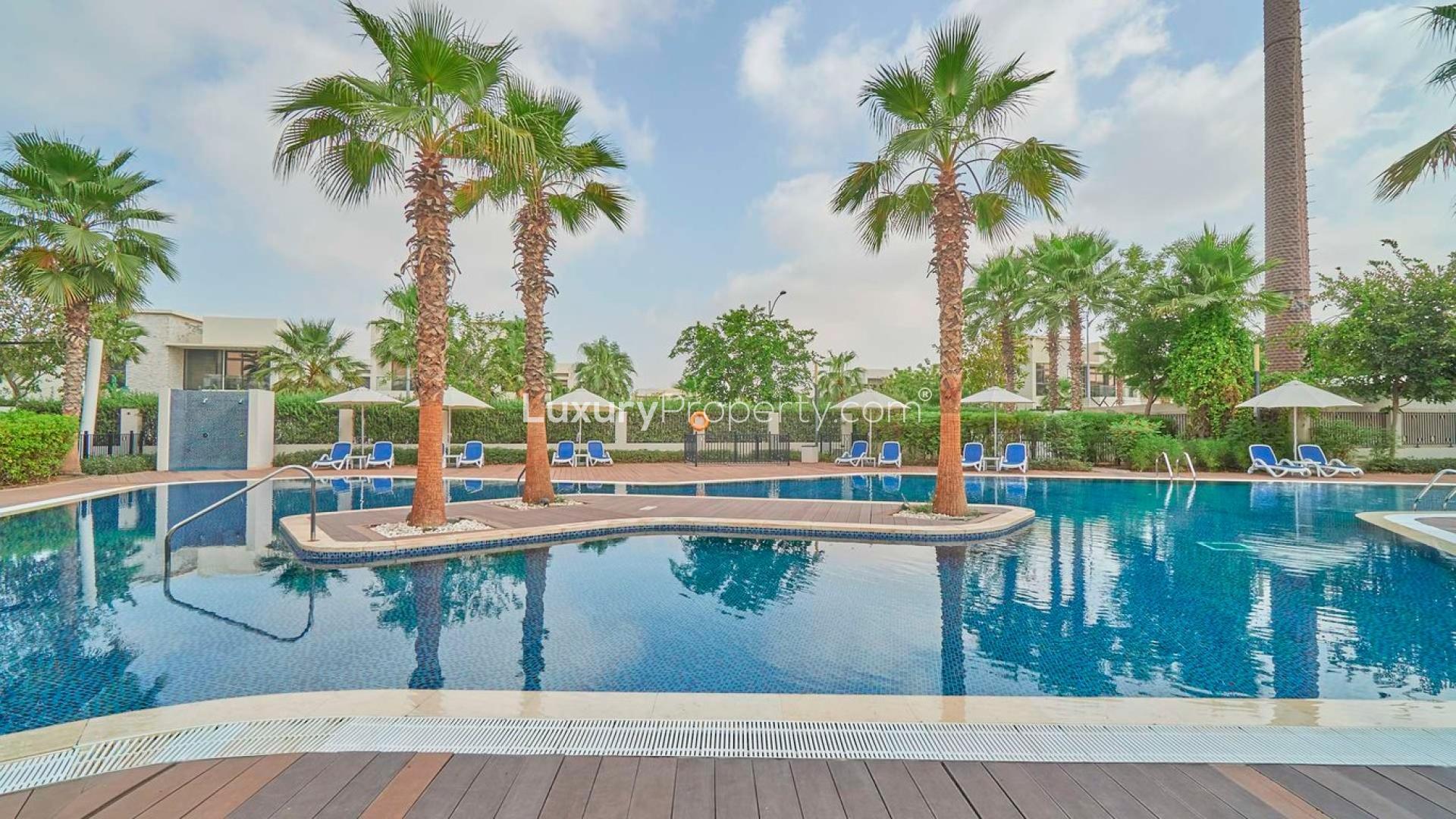 Modern 5-bedroom villa exterior with driveway in Damac Hills, Silver Springs community