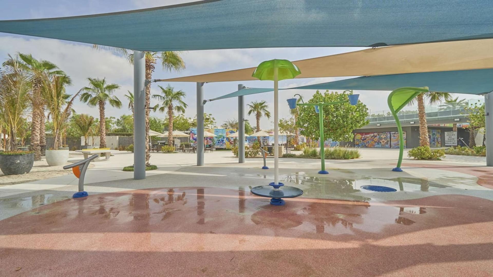 Luxurious villa interior with elegant dining area and garden view in Damac Hills