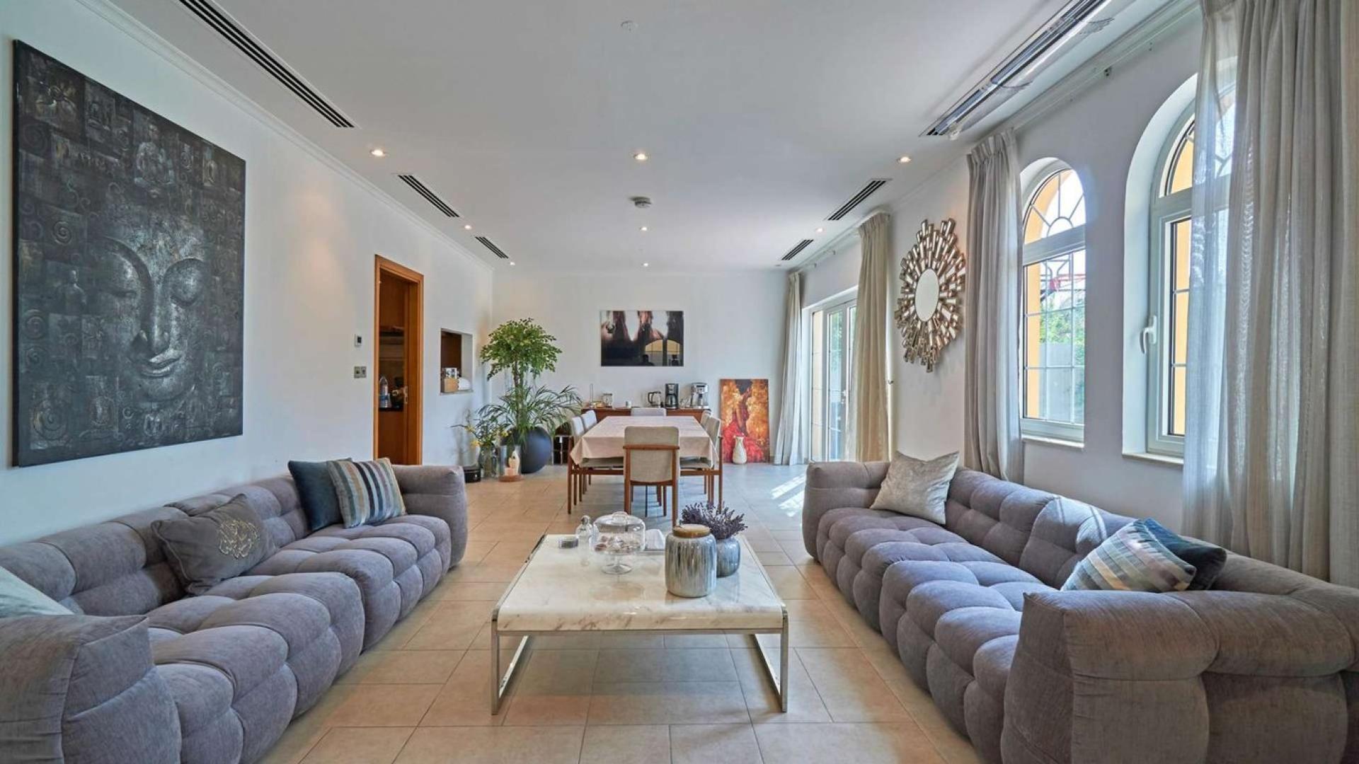 Spectacular 5-bedroom villa exterior in Jumeirah Park, Legacy, with landscaped garden pathway