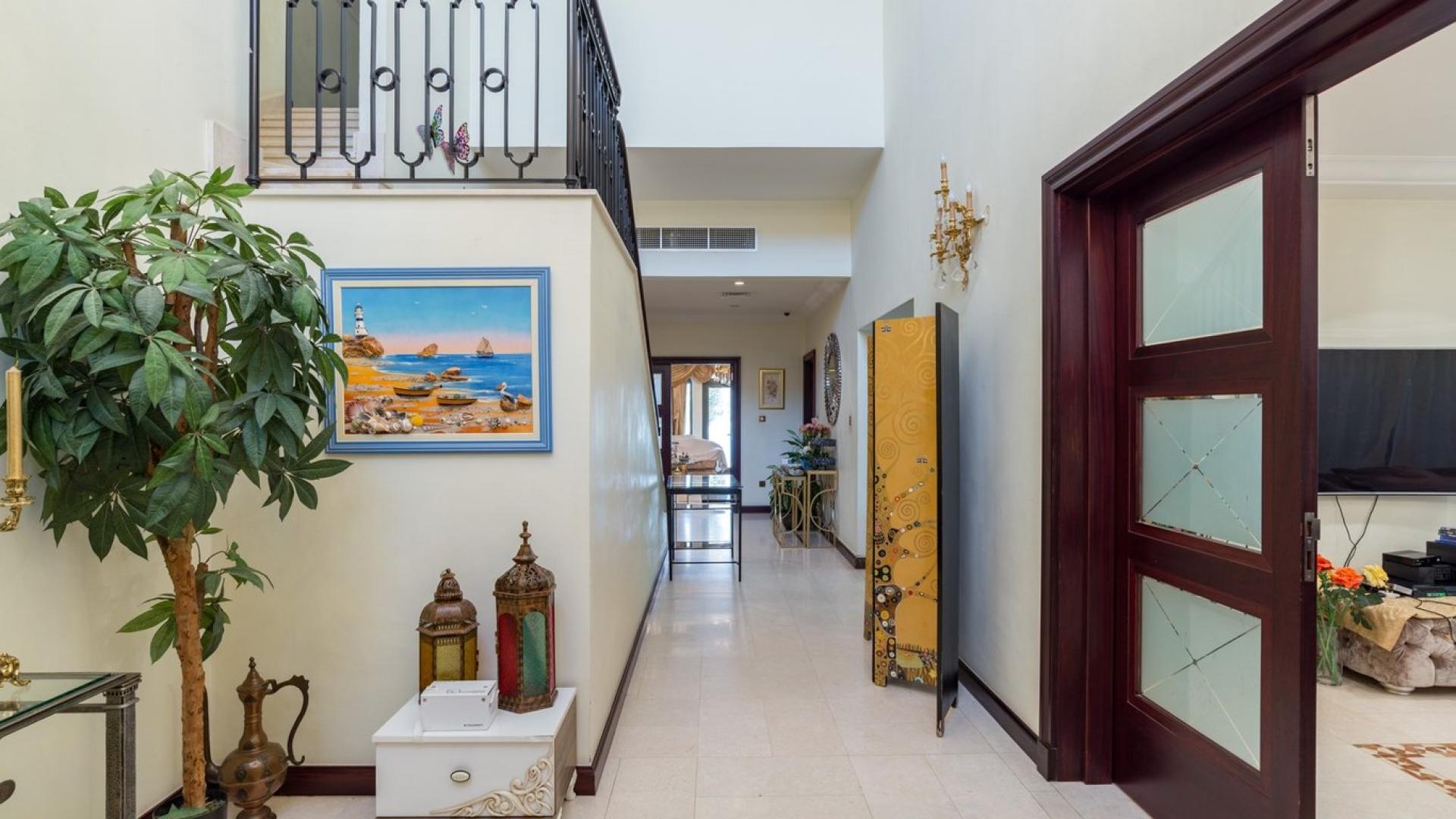 Exterior view of luxury villa with pool and patio in Palm Jumeirah Garden Homes