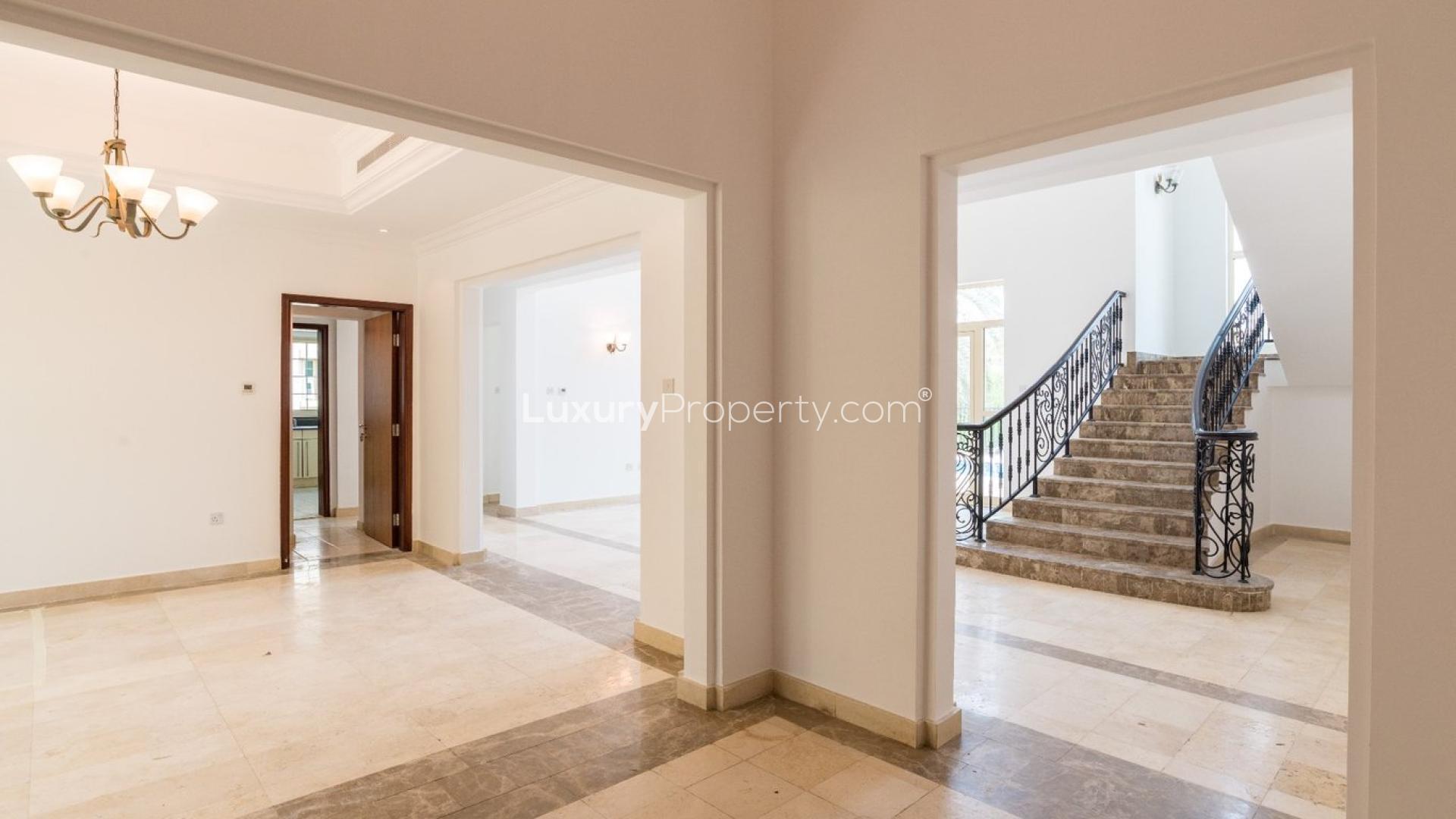 Luxurious five-bedroom villa exterior with landscaped garden in Jumeirah Islands, European Clusters