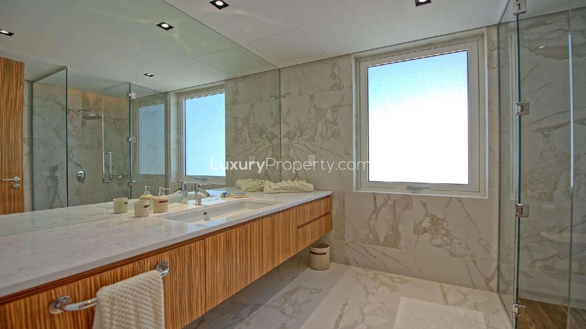 Interior view of luxury villa kitchen overlooking private beach, Palm Jumeirah, for sale
