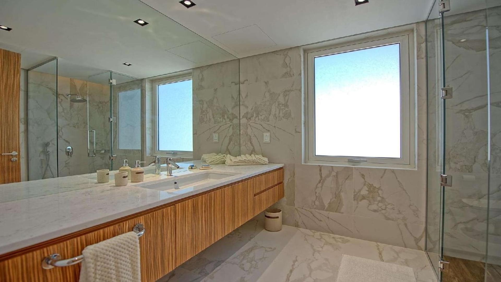 Interior view of luxury villa kitchen overlooking private beach, Palm Jumeirah, for sale