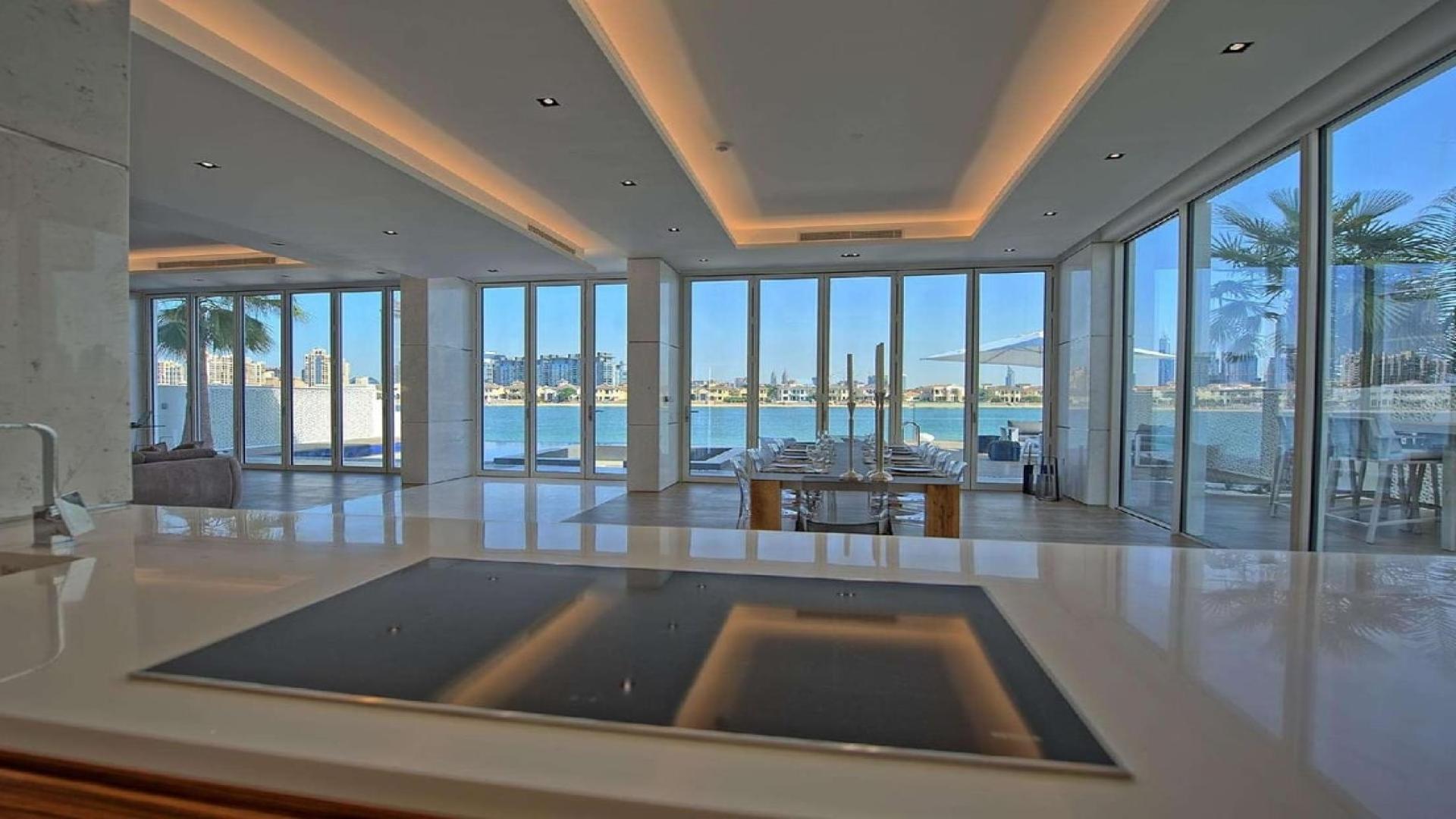 Luxurious dining area with beach view in Palm Jumeirah villa for rent