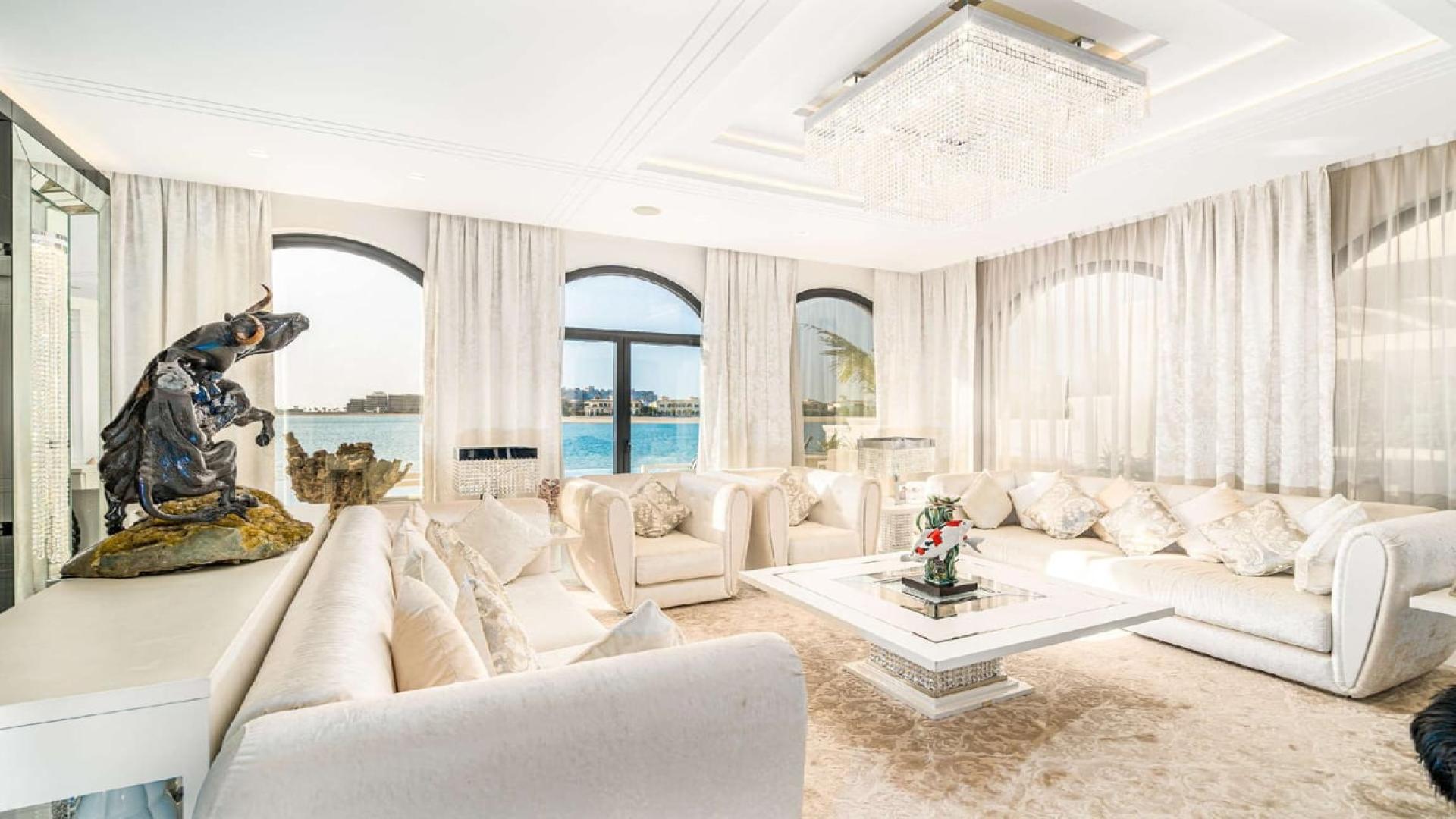 Luxurious living room in seafront villa, Palm Jumeirah, with elegant decor and sea view