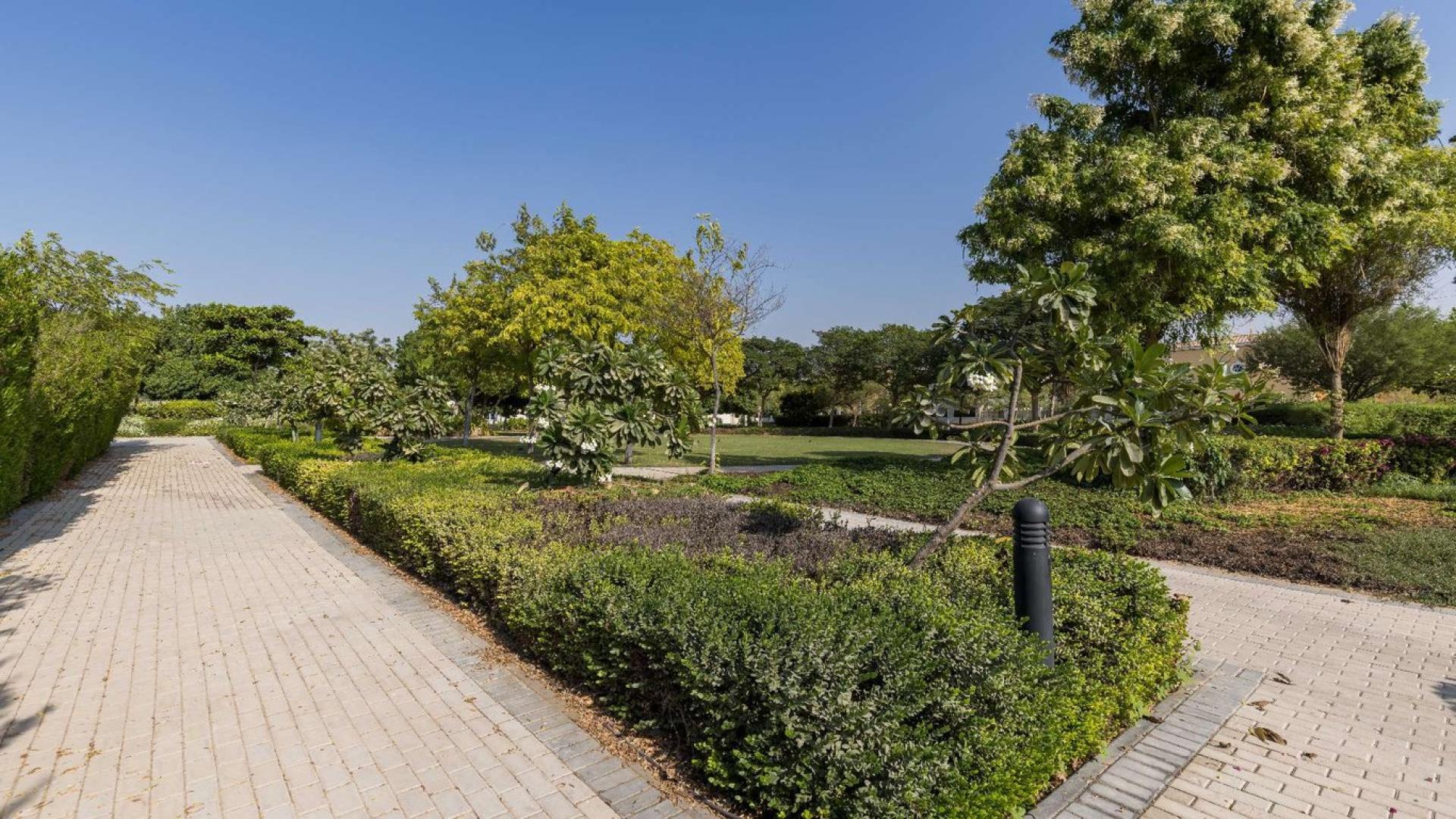 Outdoor view of spacious villa patio with pool in Legacy, Jumeirah Park, Dubai